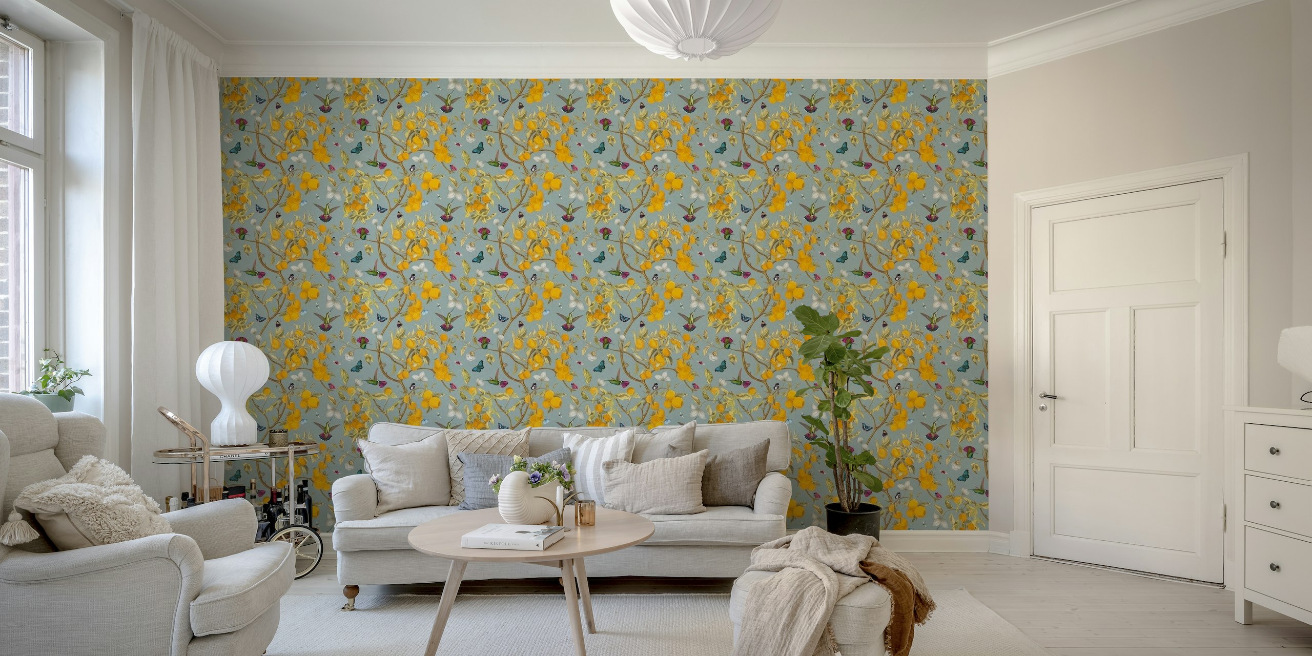 Wall mural with hummingbirds, lemons, and butterflies on a sky-blue background