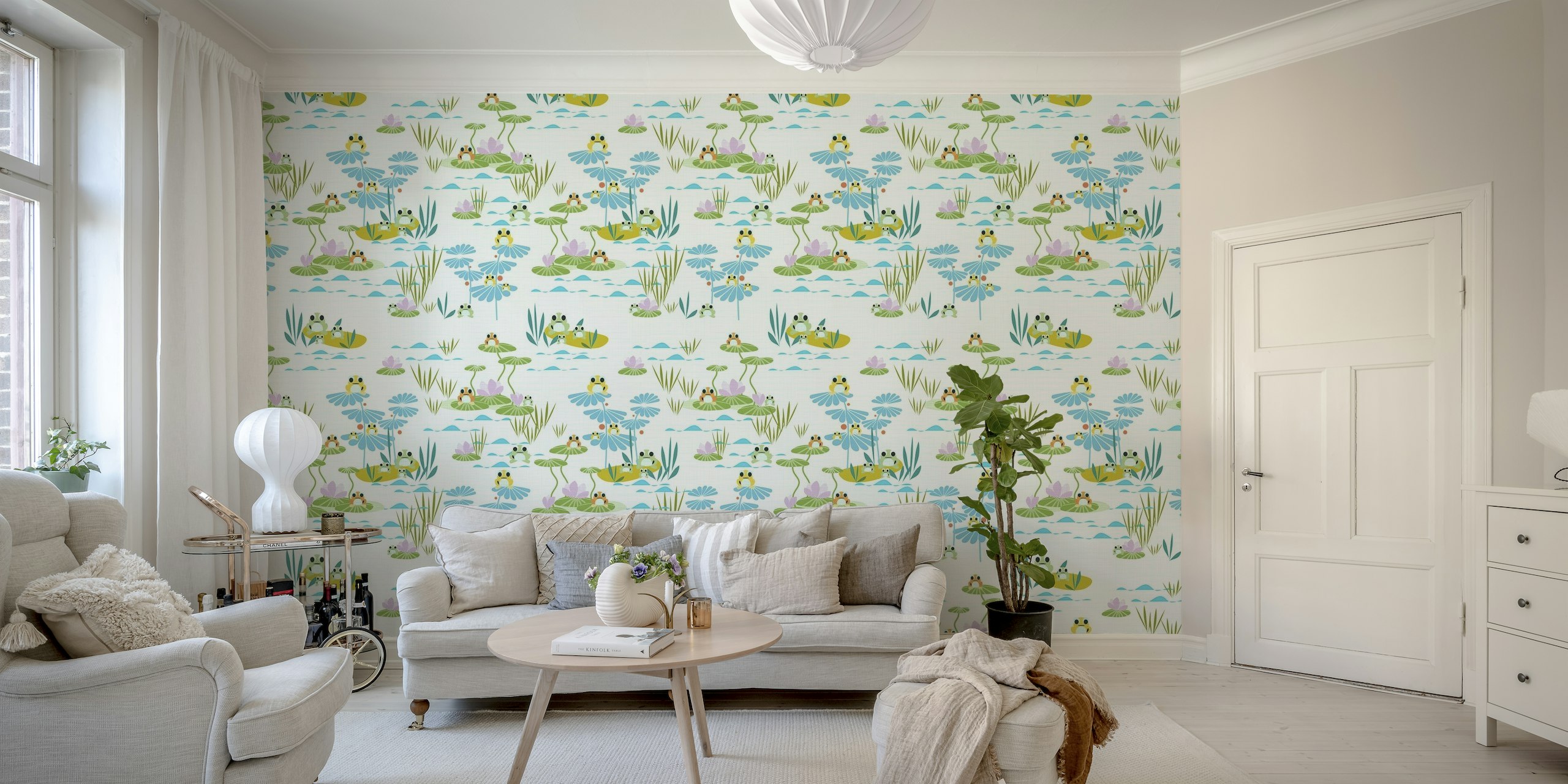 Illustrated wall mural of playful frogs on lily pads in a pond with blue water and floral elements.