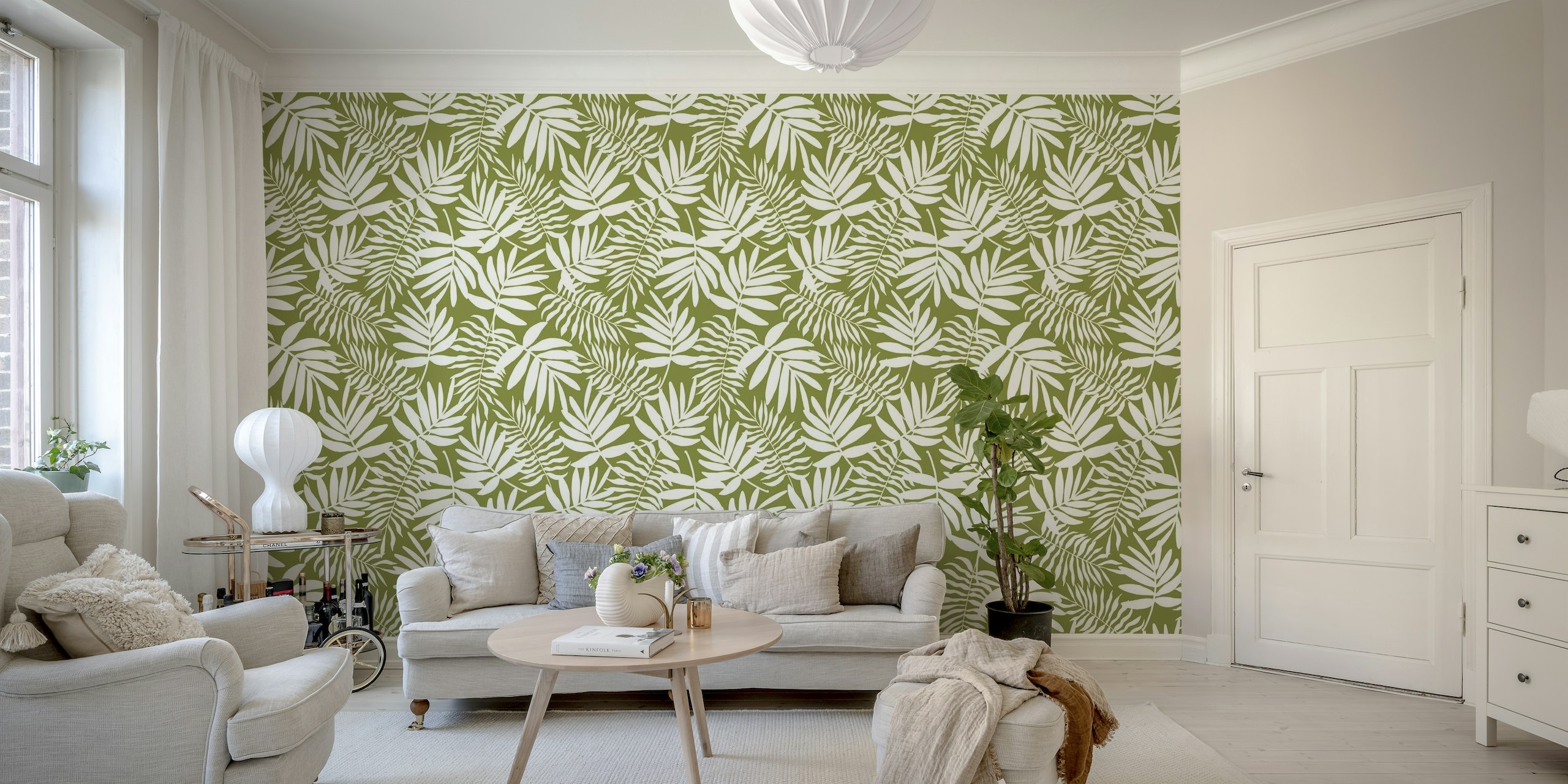 White palm leaves on green wallpaper