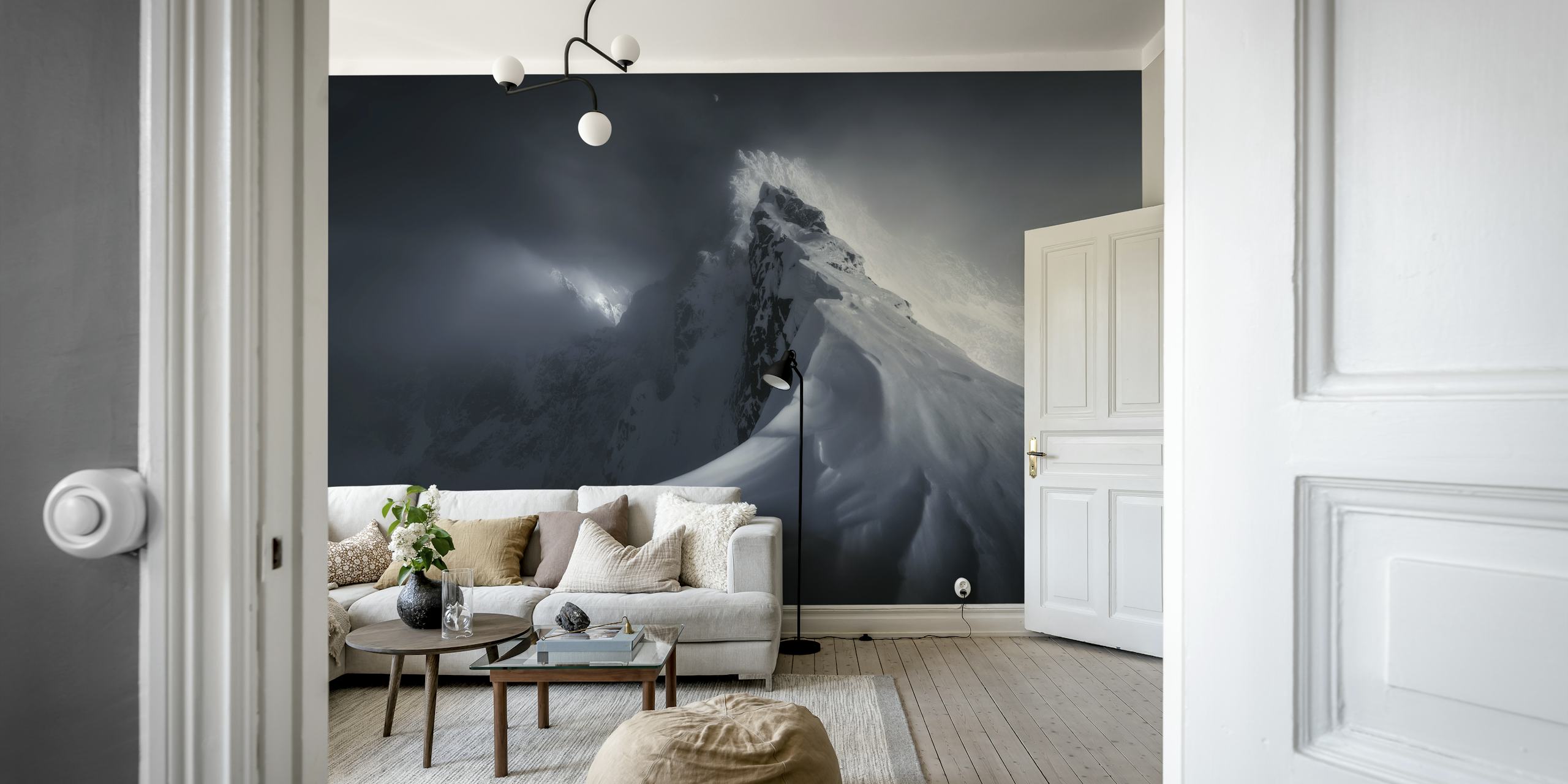 Majestic snowy mountain peak with dark clouds wallpaper