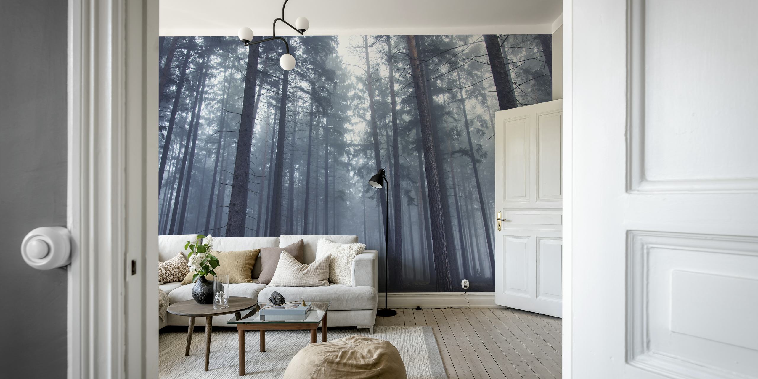 Foggy forest with tall trees and misty atmosphere wallpaper