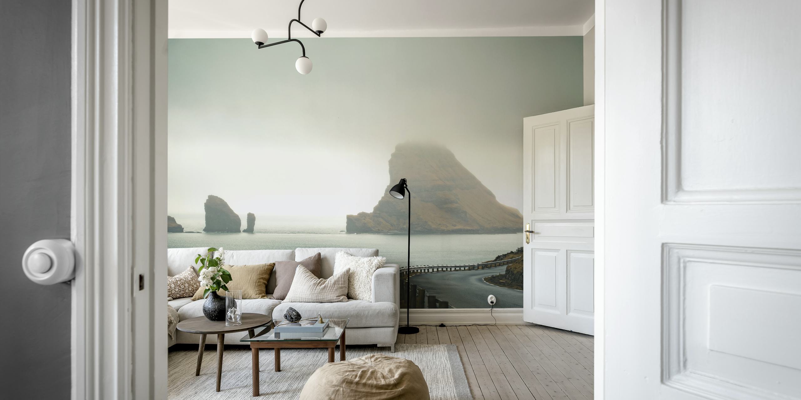 Coastal landscape with misty hills and rocky formations wallpaper