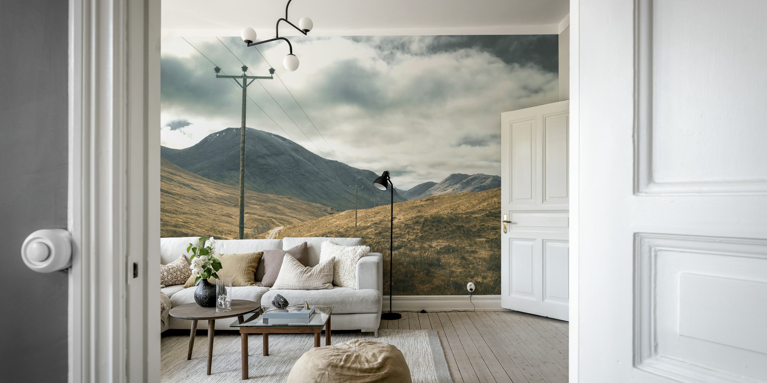 Winding road landscape in Scottish Highlands with gray clouds and mountains wallpaper