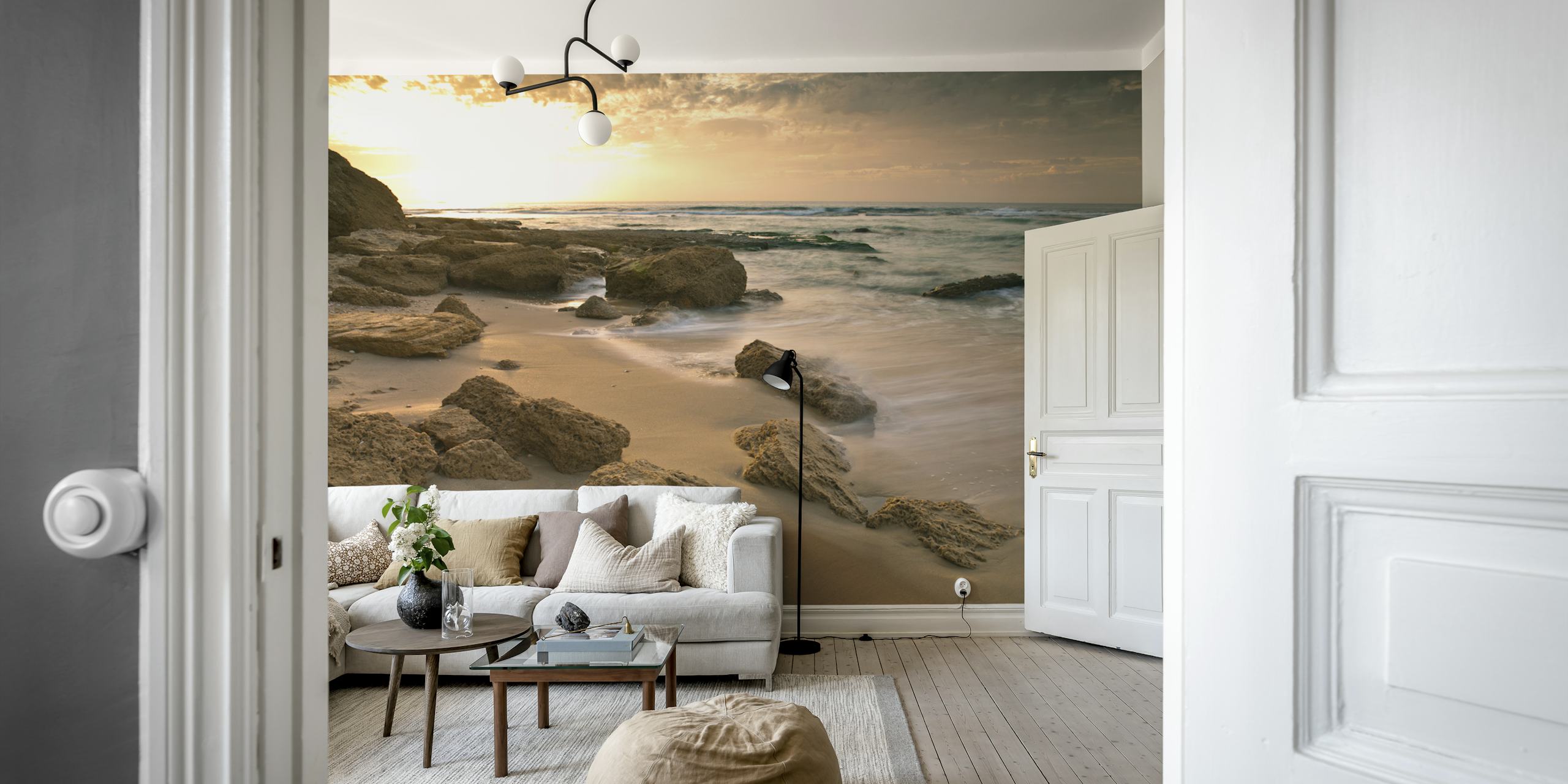 Sandy beach with rocky shores and ocean waves wallpaper