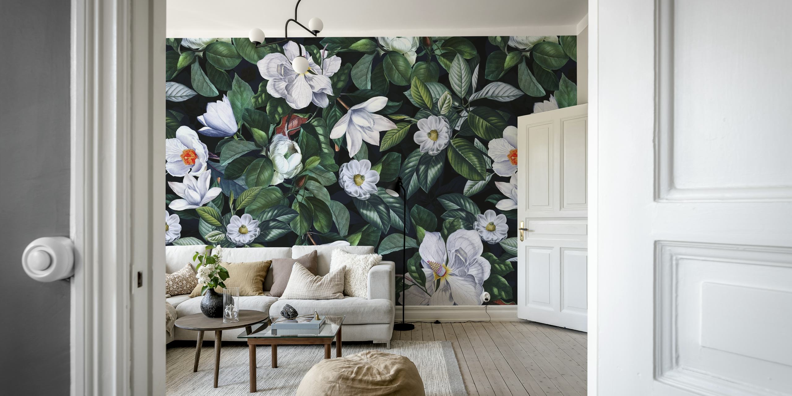 White magnolia flowers and green leaves on dark background wallpaper