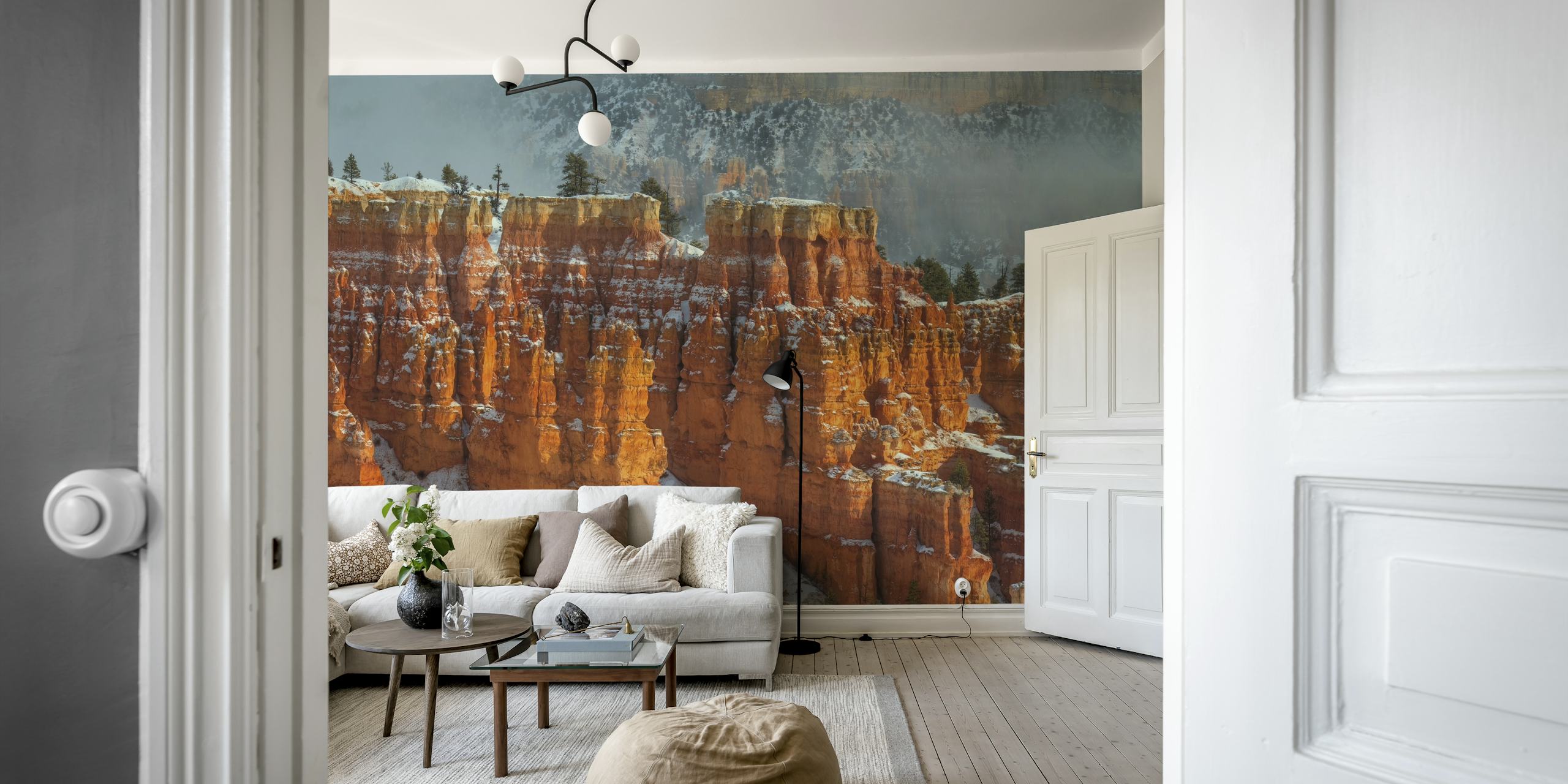 Orange rock formations with snow accents wallpaper