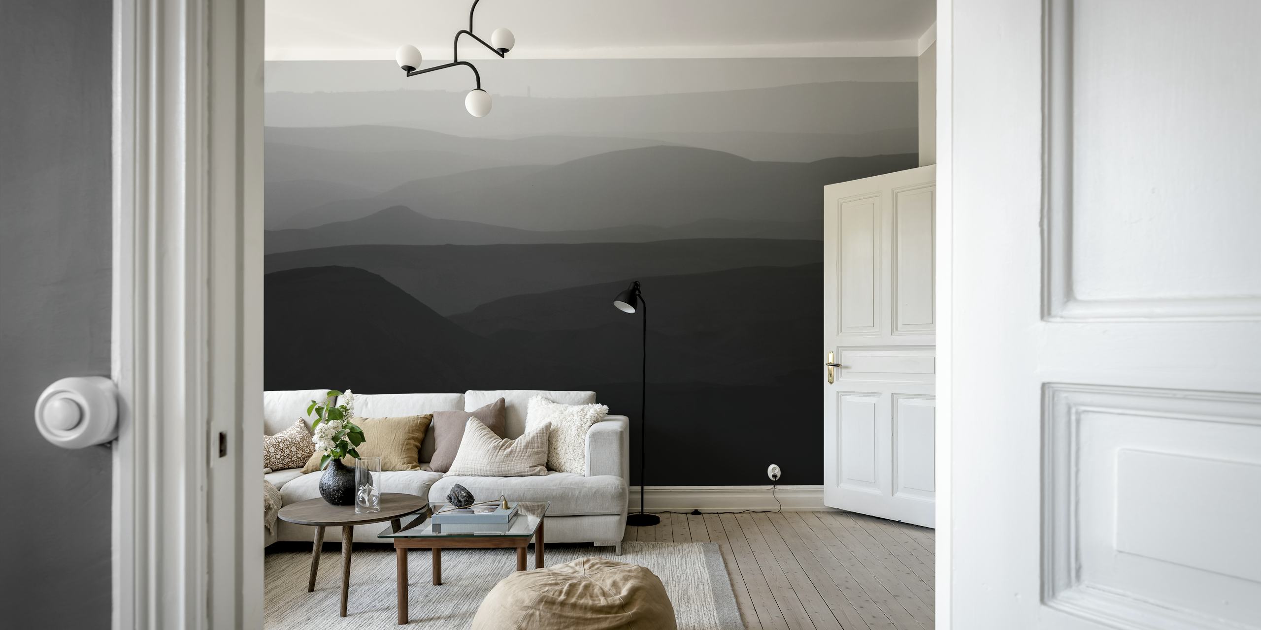 Svart og hvitt veggmaleri som viser de bølgende åsene i Judea-ørkenen