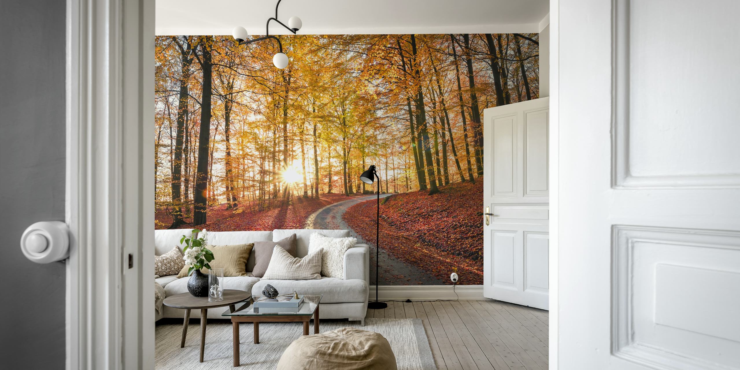 Winding road through a golden autumn forest wallpaper