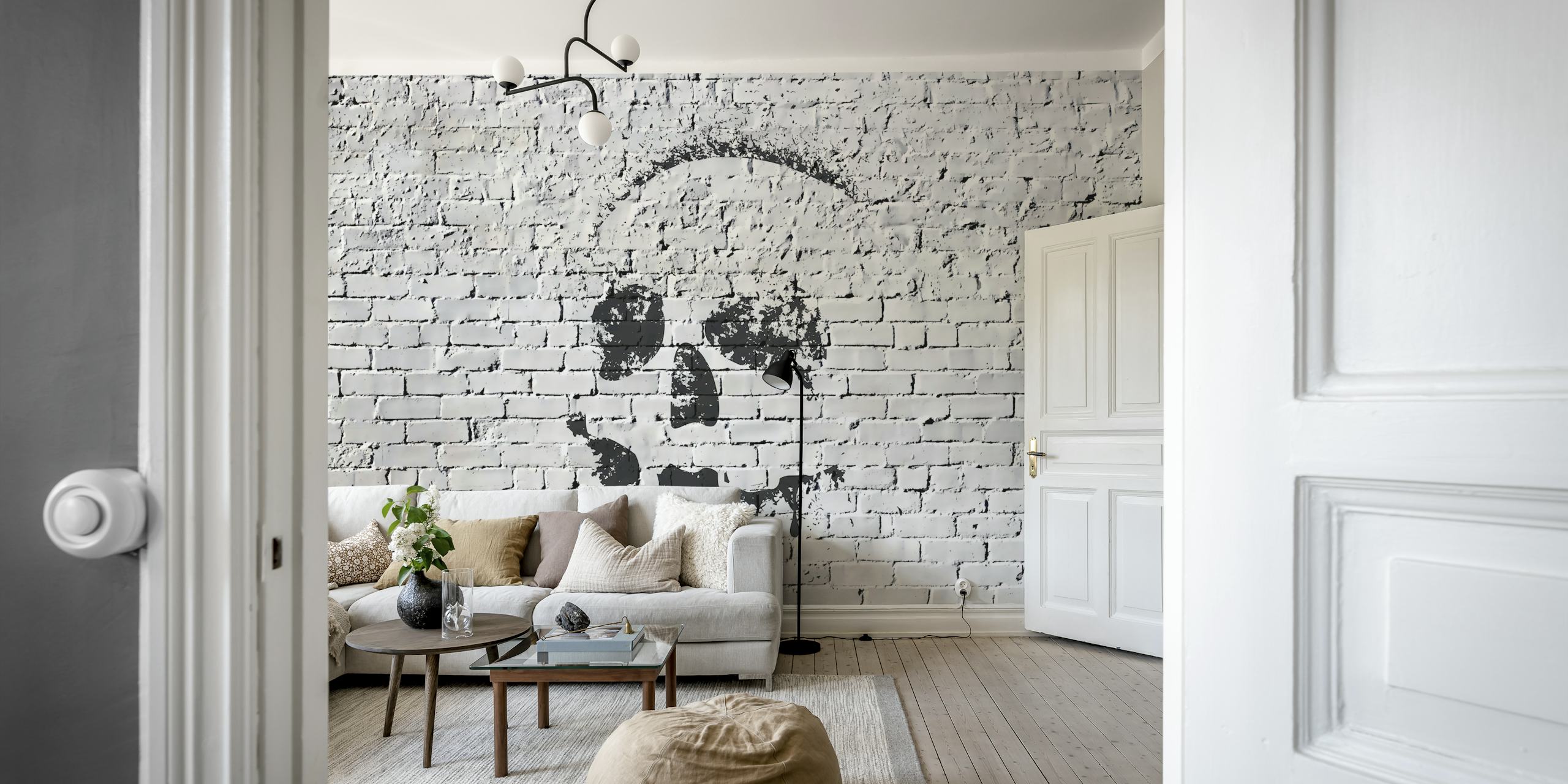 Zwart-witte skull design op een bakstenen muur wallpaper