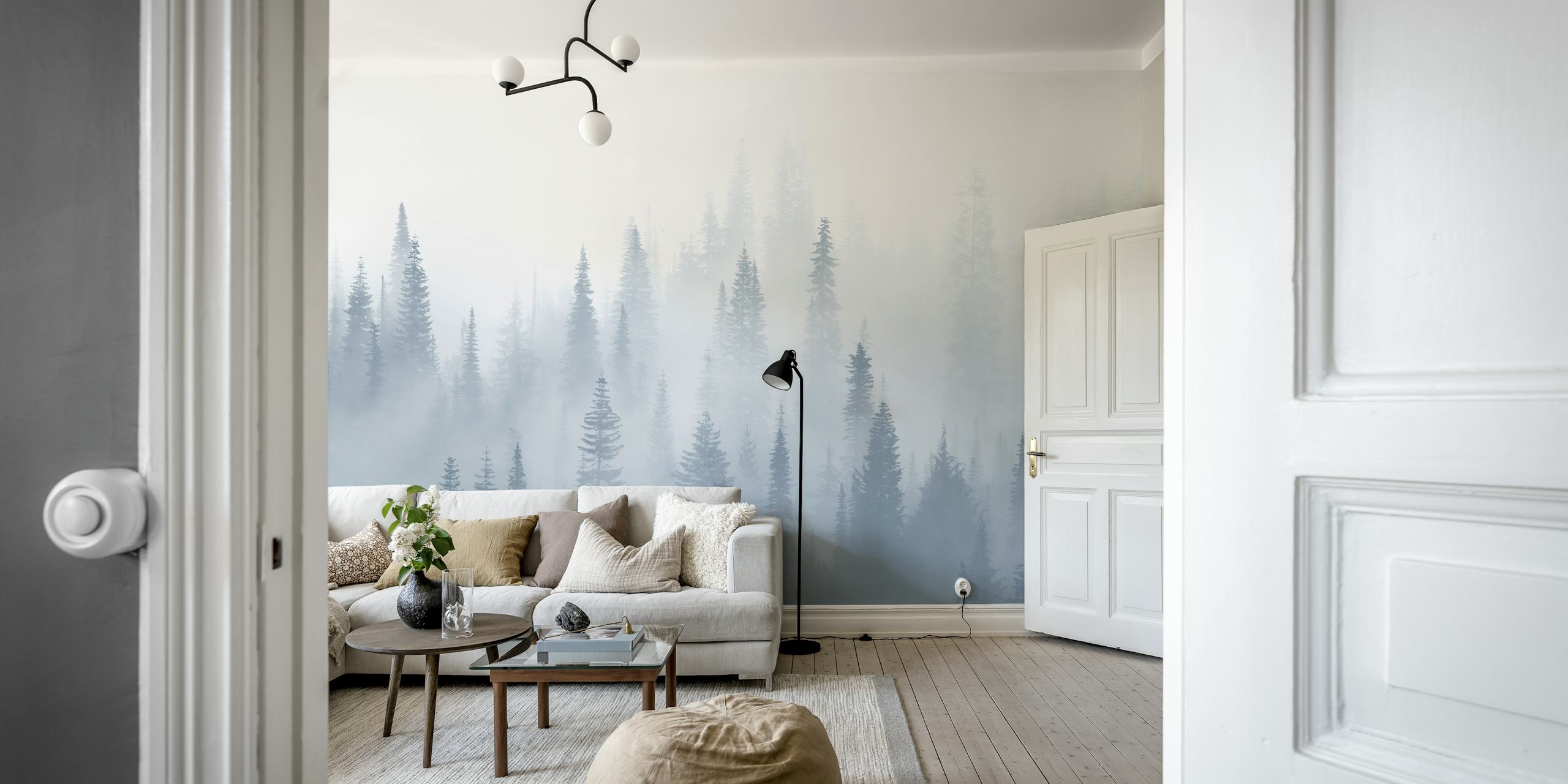 Misty forest landscape with evergreen trees in soft blue hues wallpaper