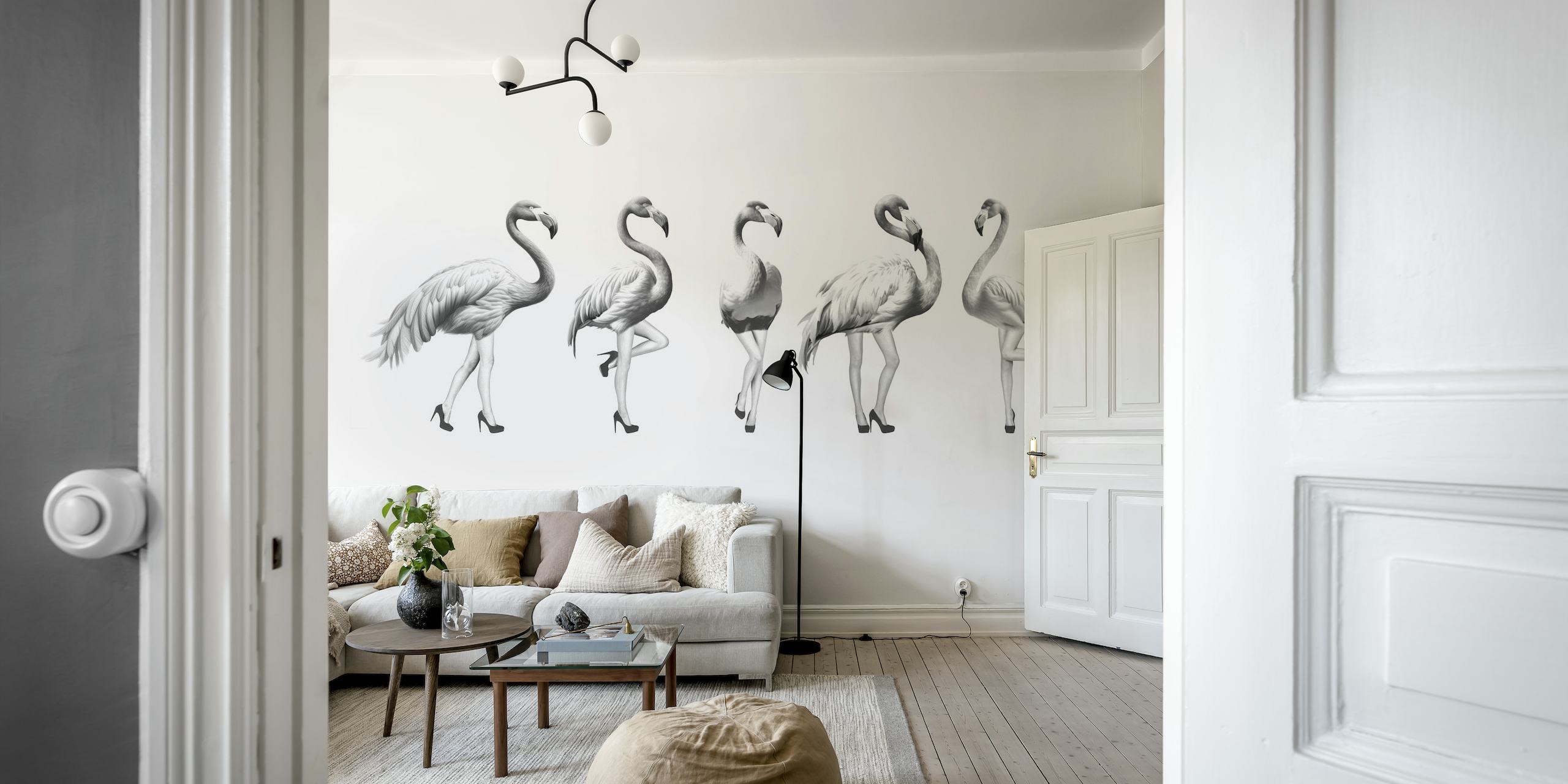 Mustavalkoinen seinämaalaus leikkisistä flamingoista harmaan sävyissä