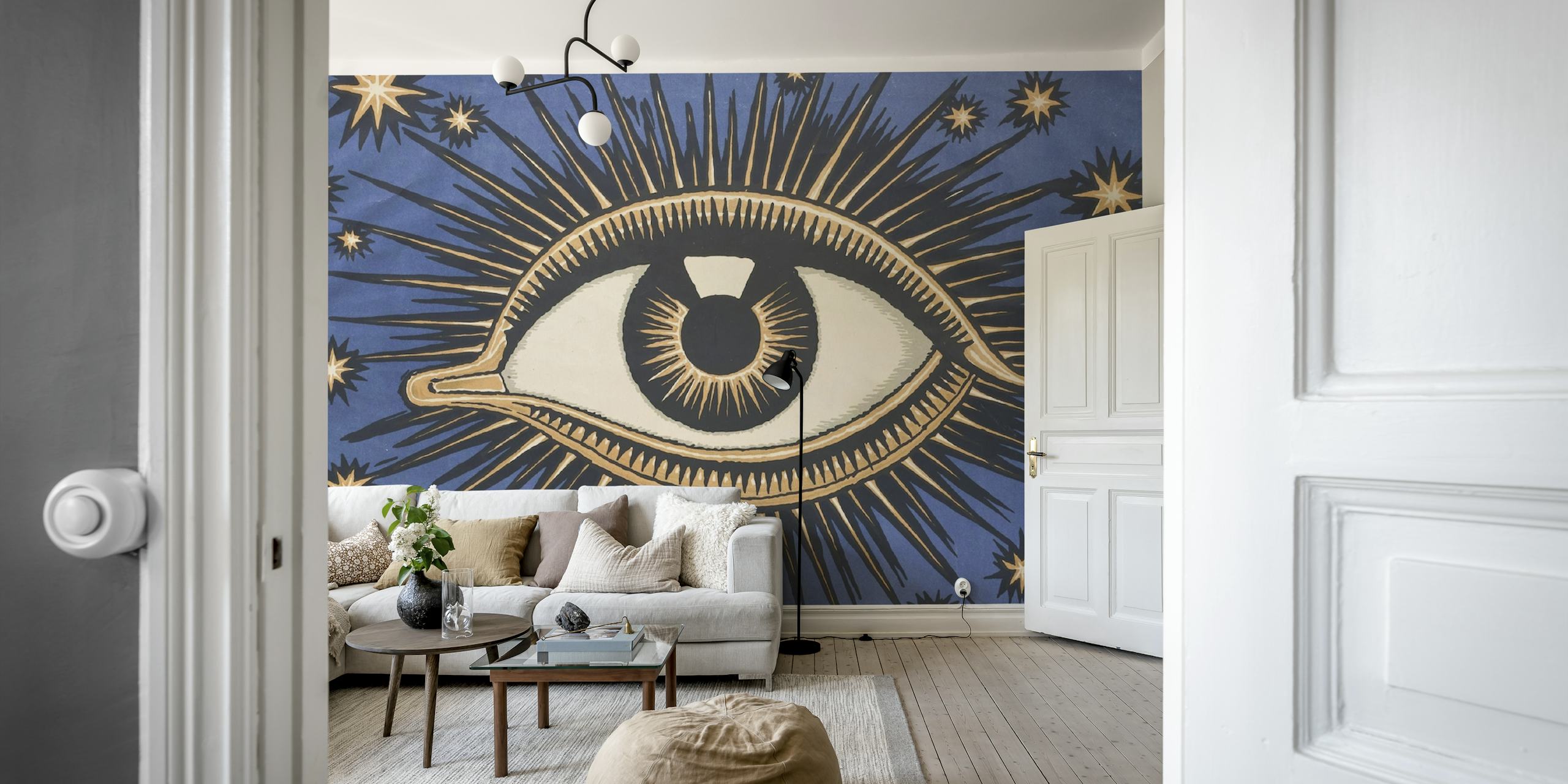 Celestial eye design with golden rays on blue background wallpaper