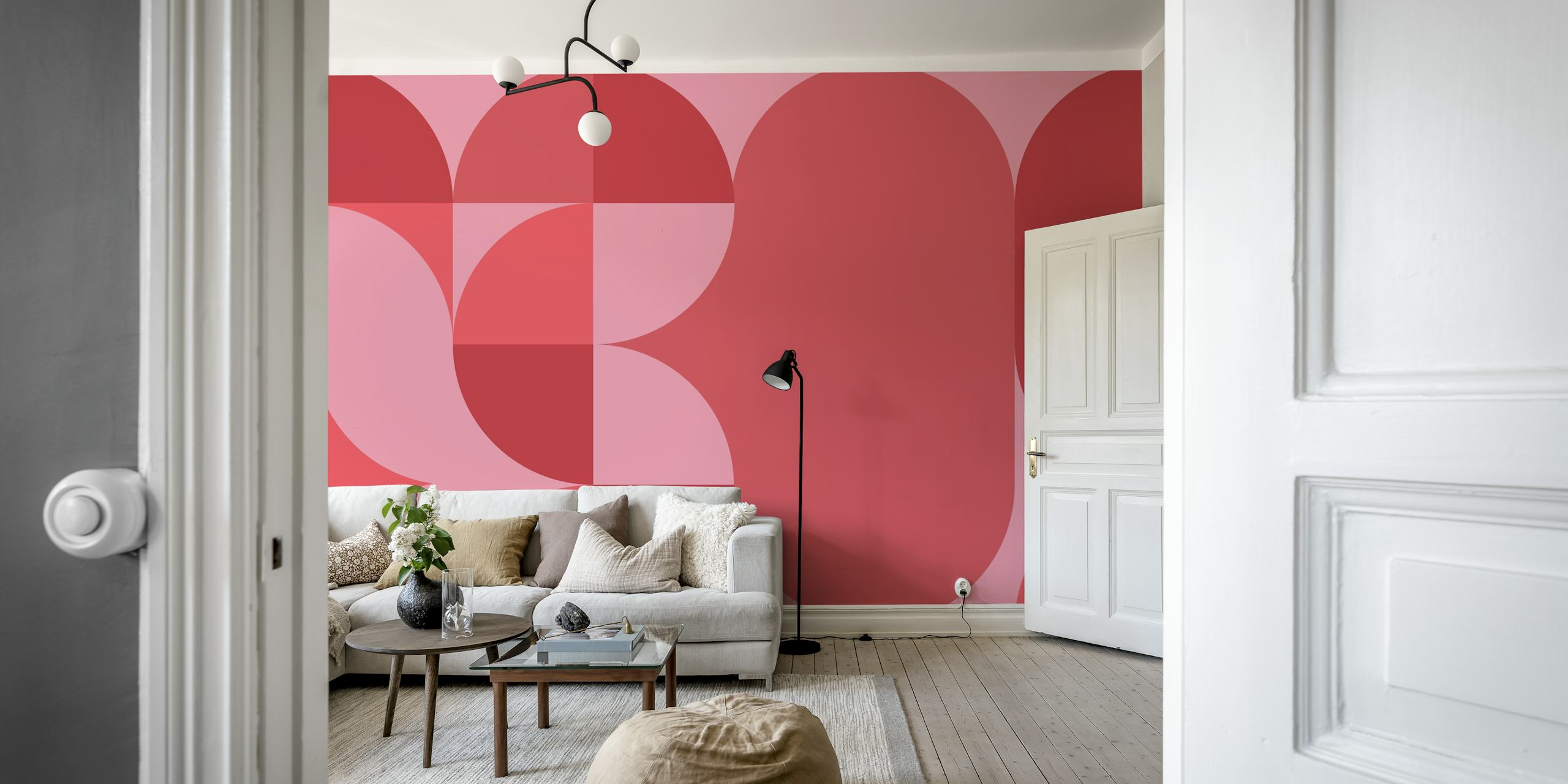 Geometric shapes in coral, pink, and red tones wallpaper