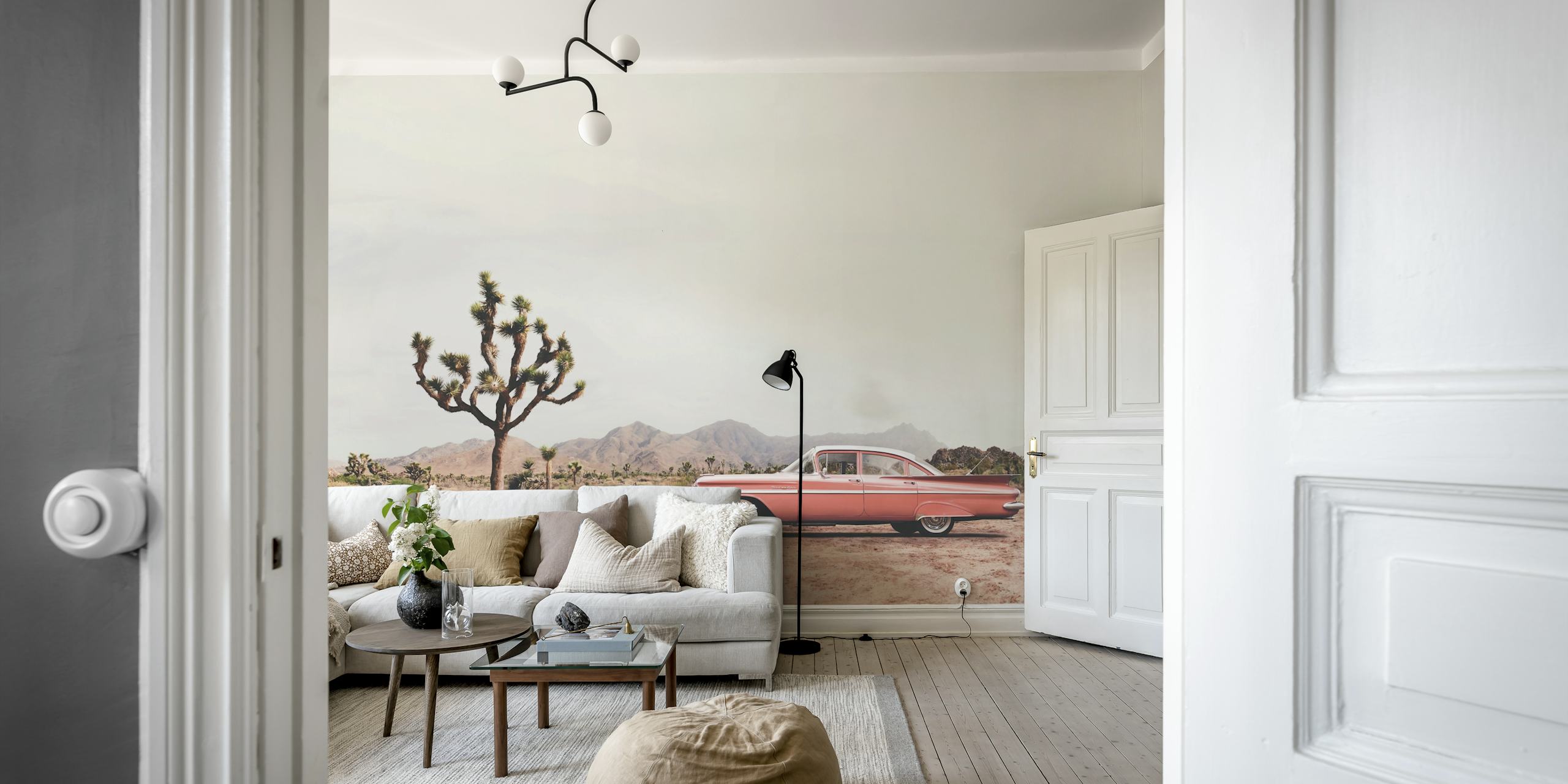 A vintage car in a desert landscape with a Joshua tree, pink tones wallpaper