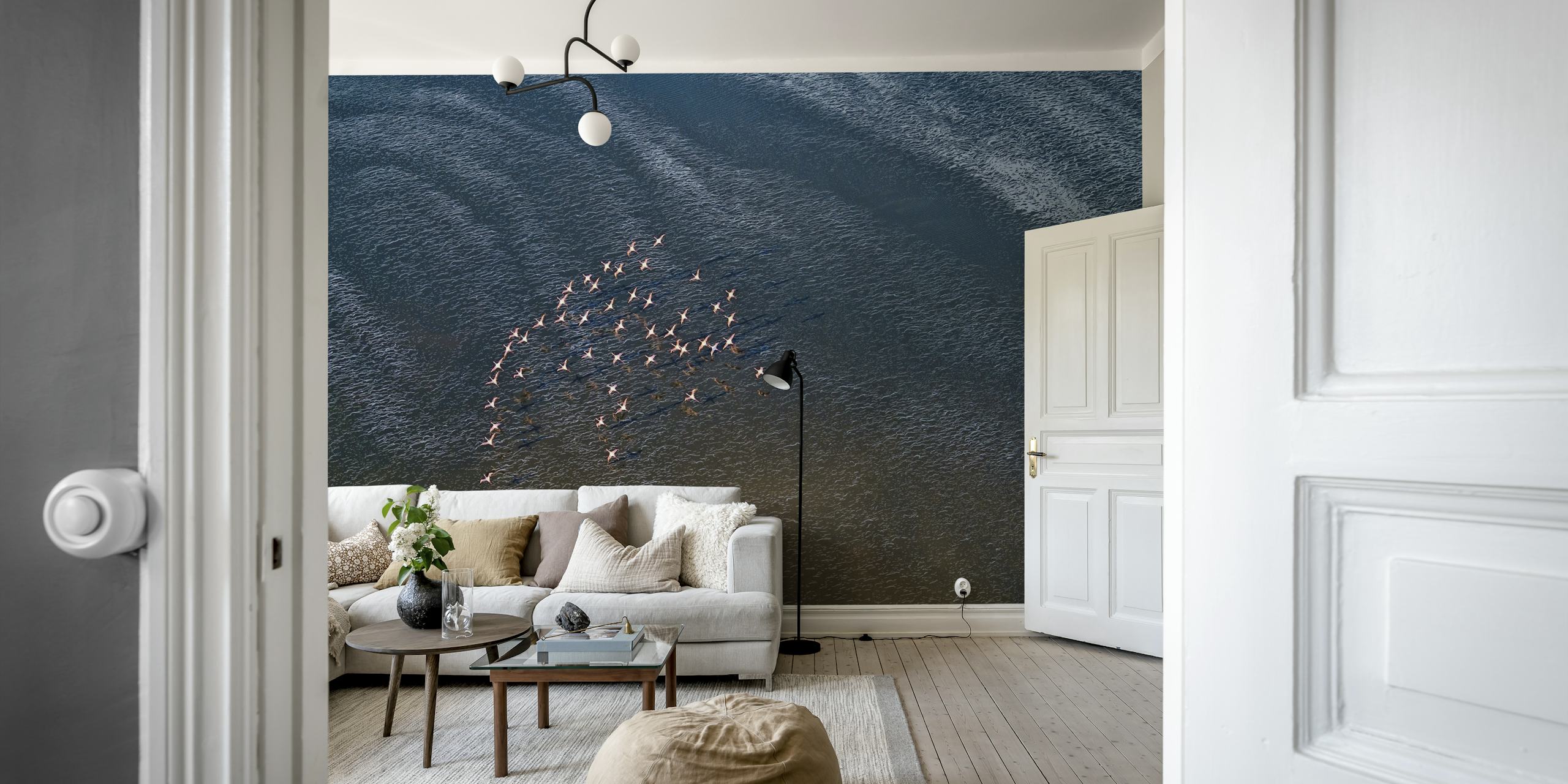 Flock of birds flying over ocean waves wall mural