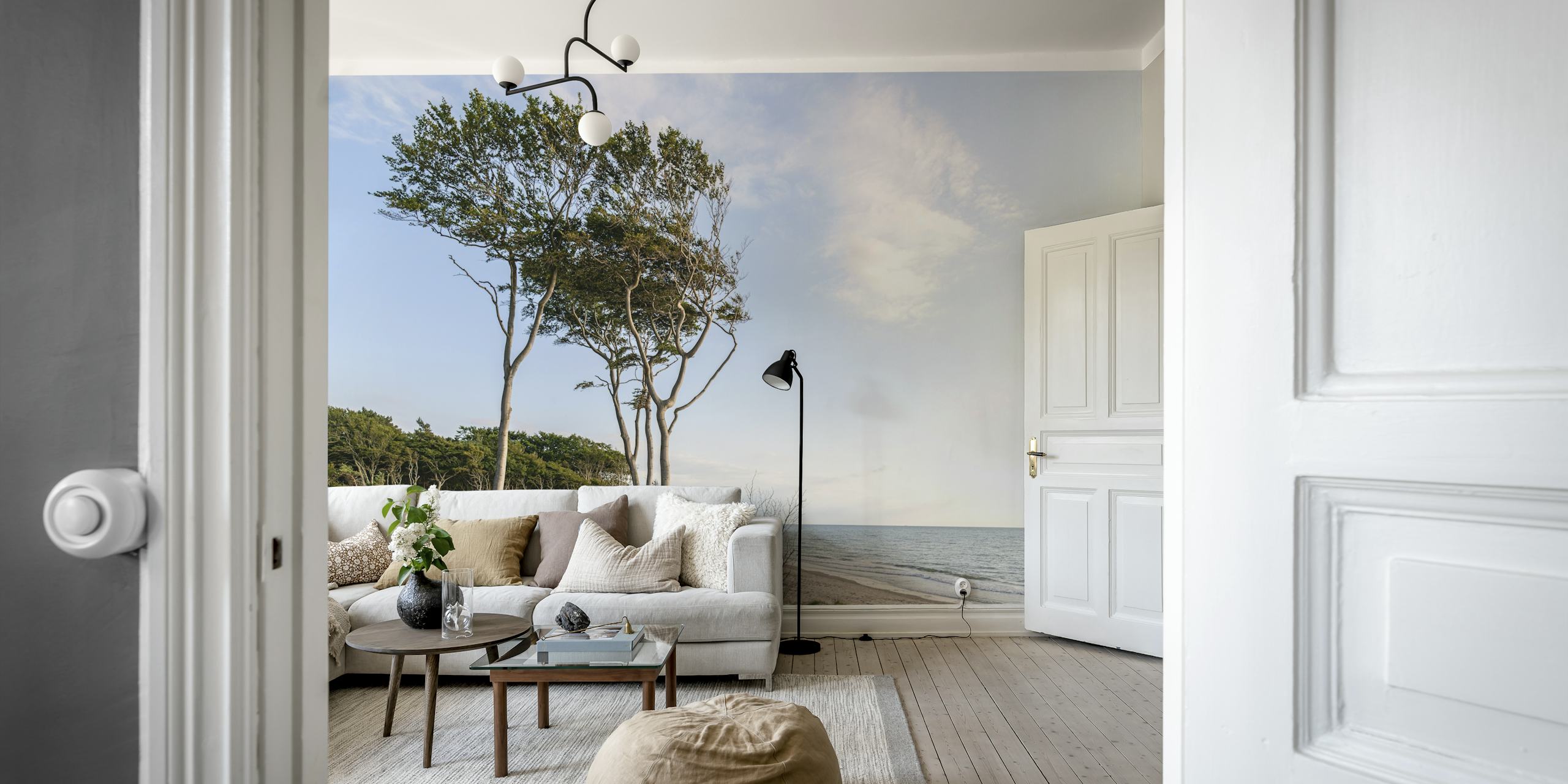 Trees on a beach with soft blue ocean and sky wallpaper