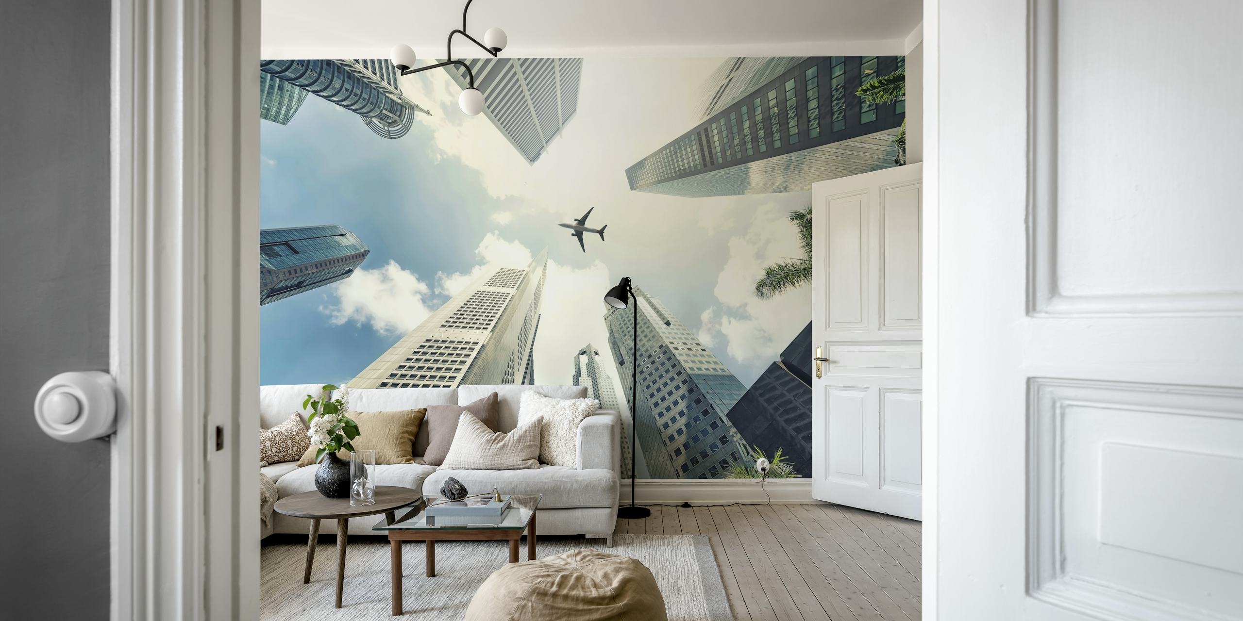 Aerial view of urban high-rises and airplane in the sky wallpaper
