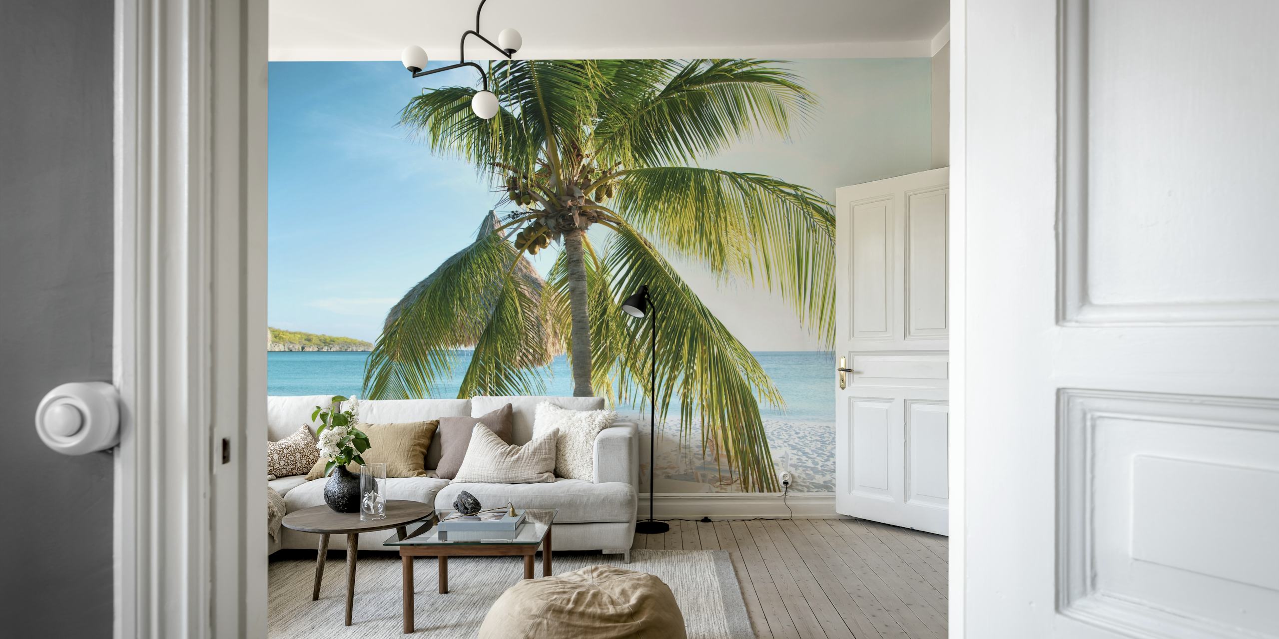Tropical palm trees against a blue ocean and sky wallpaper