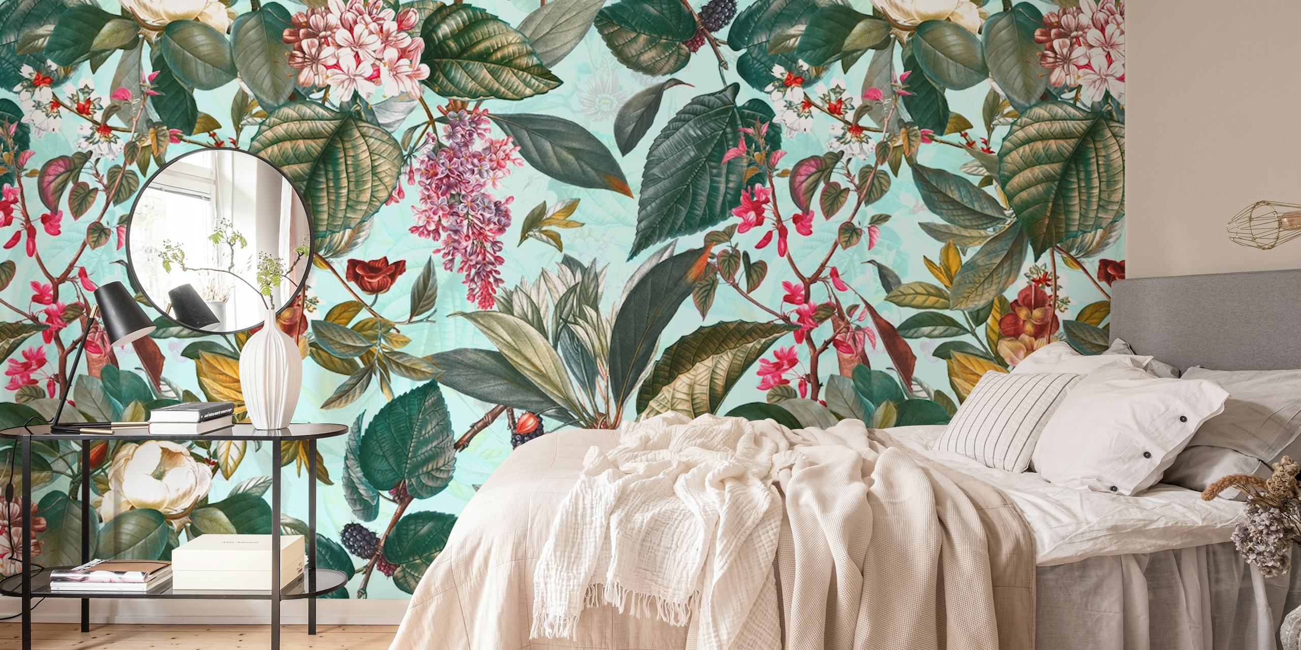 Colorful floral and leaf pattern in green, pink, and blue wallpaper.