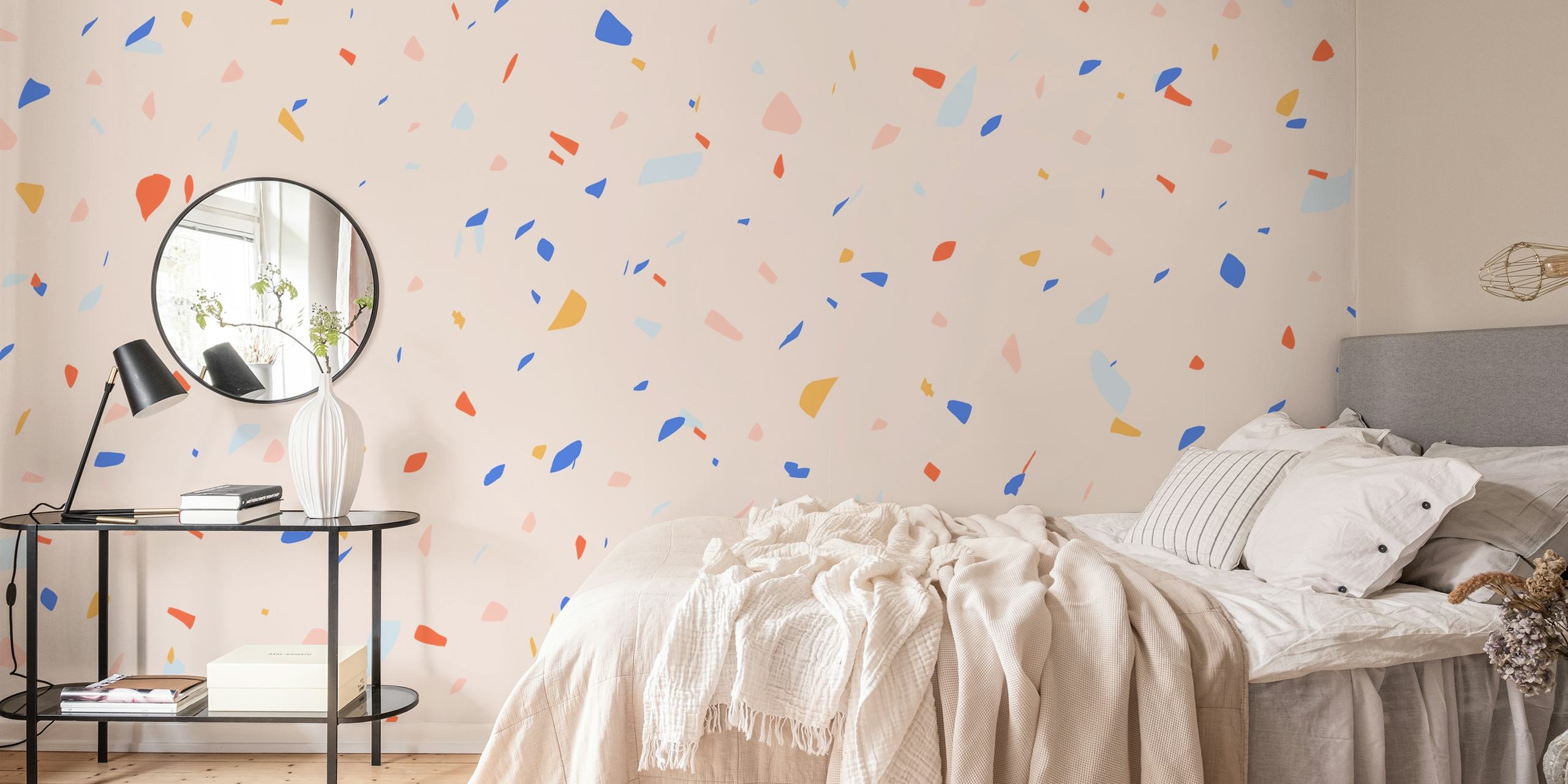 Colorful terrazzo pattern in pink, blue, and yellow wallpaper