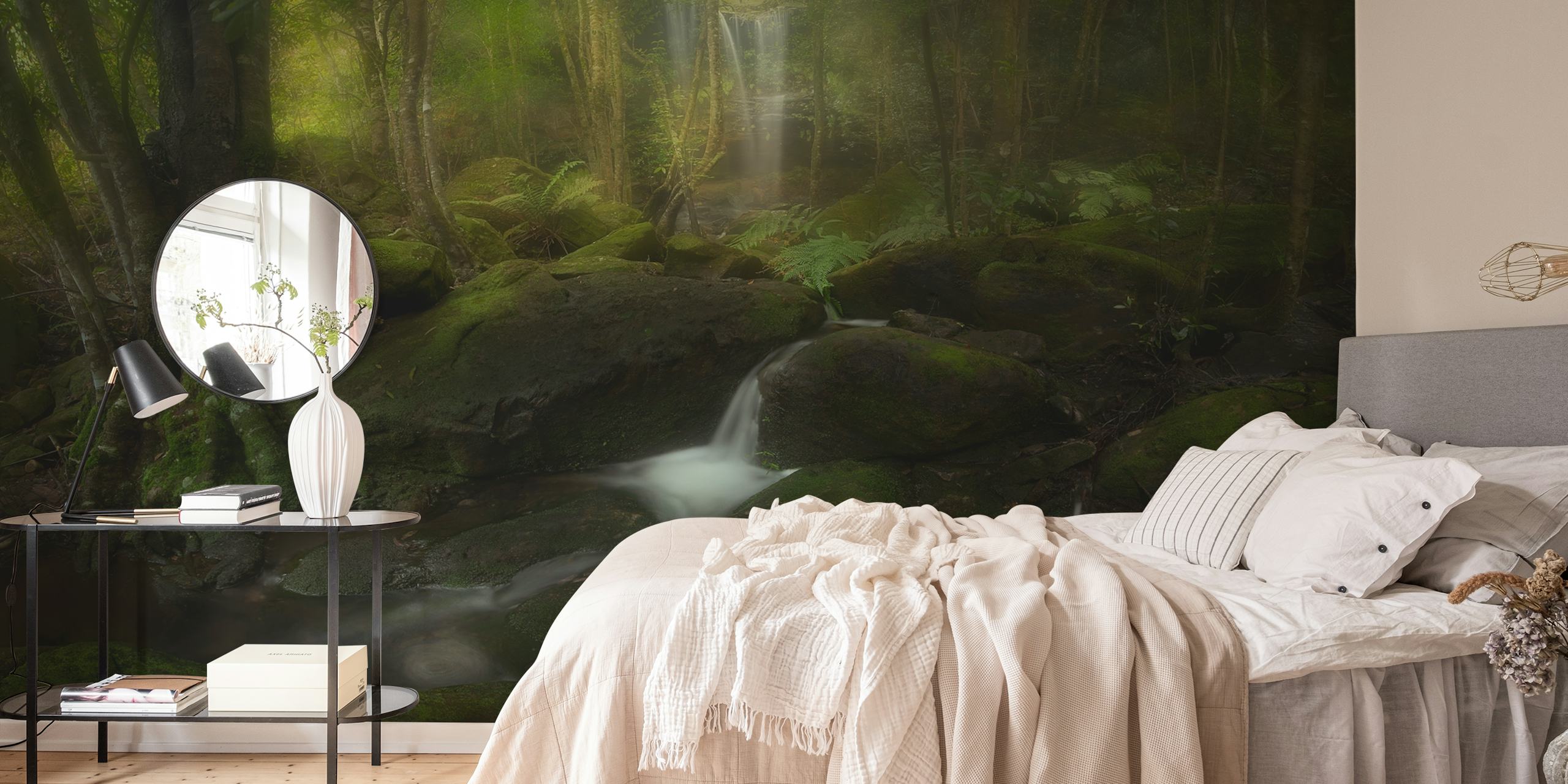 Lush green forest with a waterfall and rocks wallpaper
