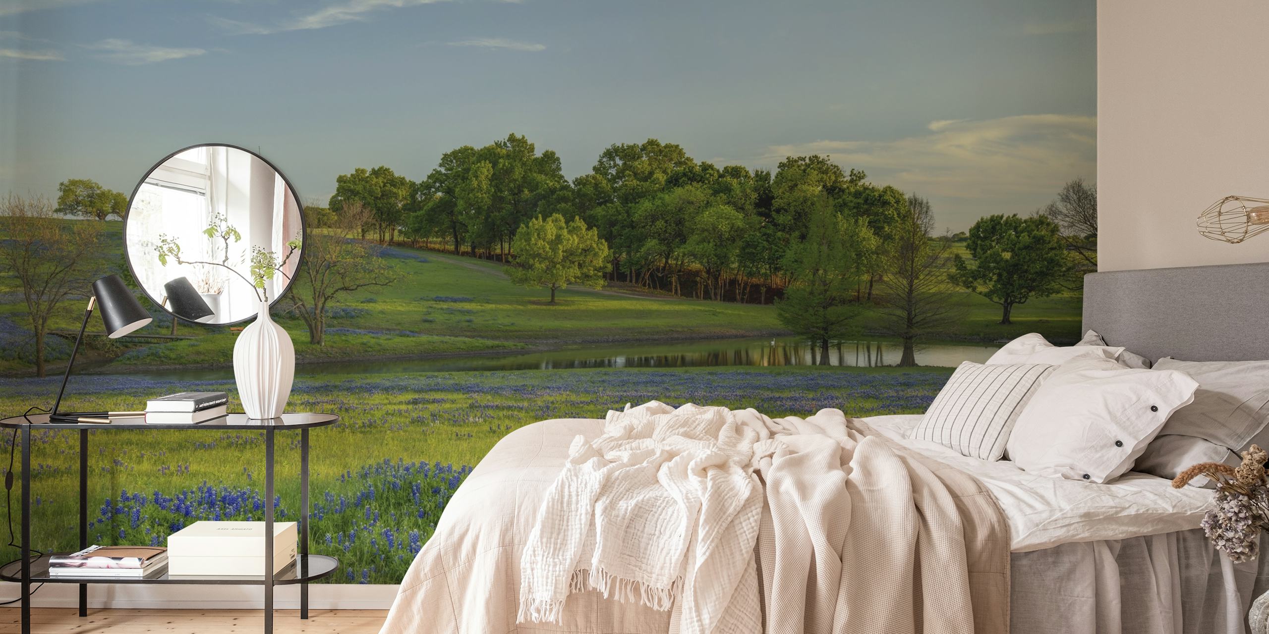 Blue floral patterns over green grass wallpaper