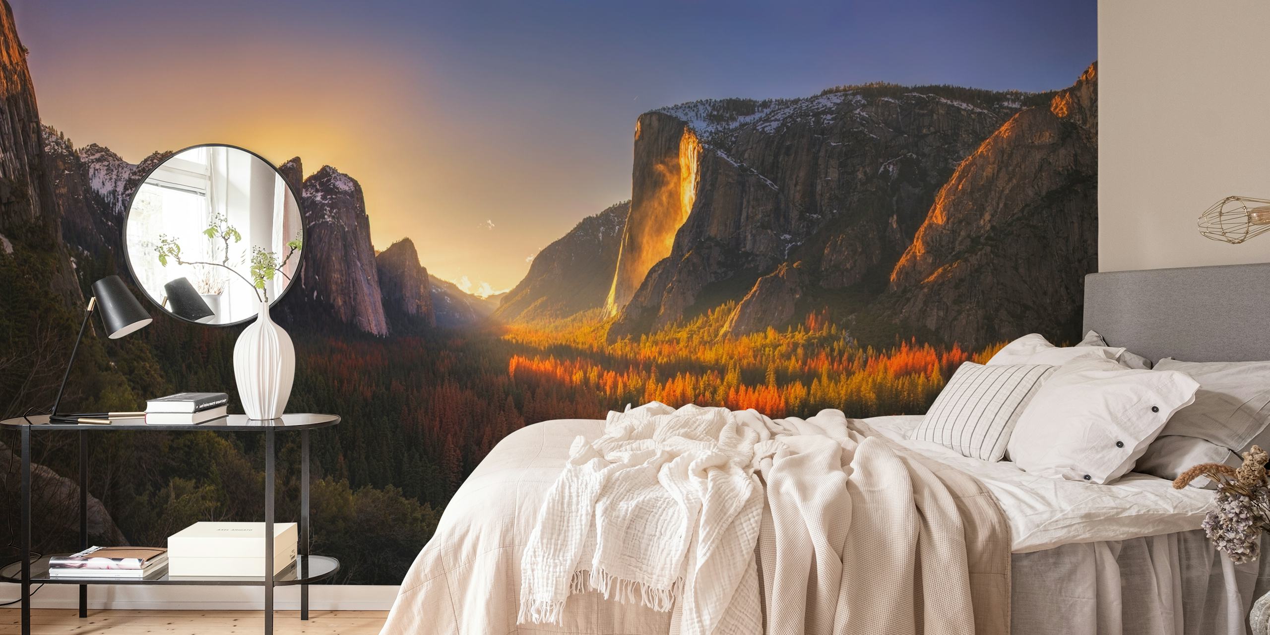 A vivid sunset over Yosemite's Firefall, showcasing red, orange, and gold tones against majestic mountains. Nature wallpaper