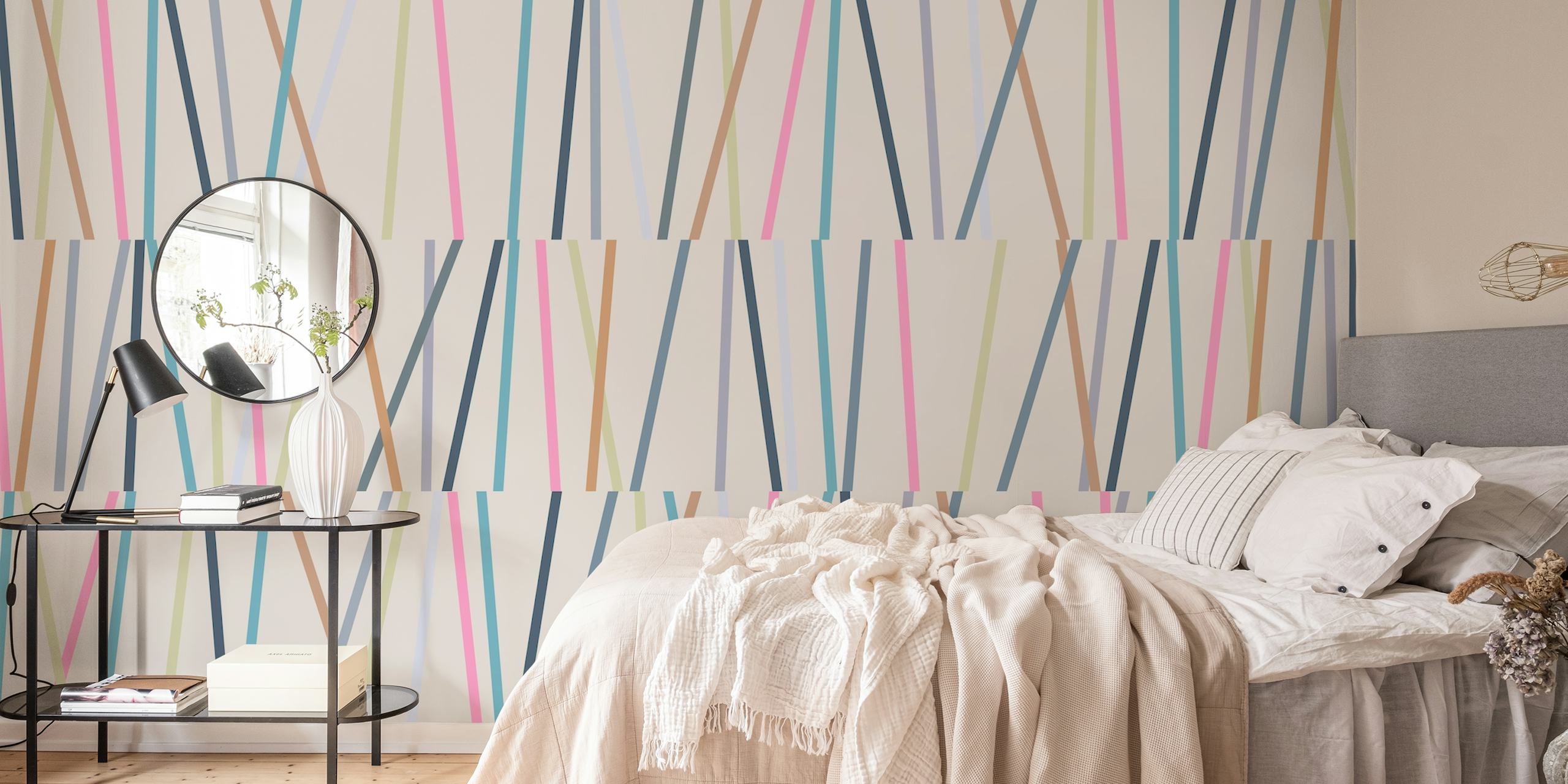 Geometric lines in pink, blue, beige, and green on cream wallpaper