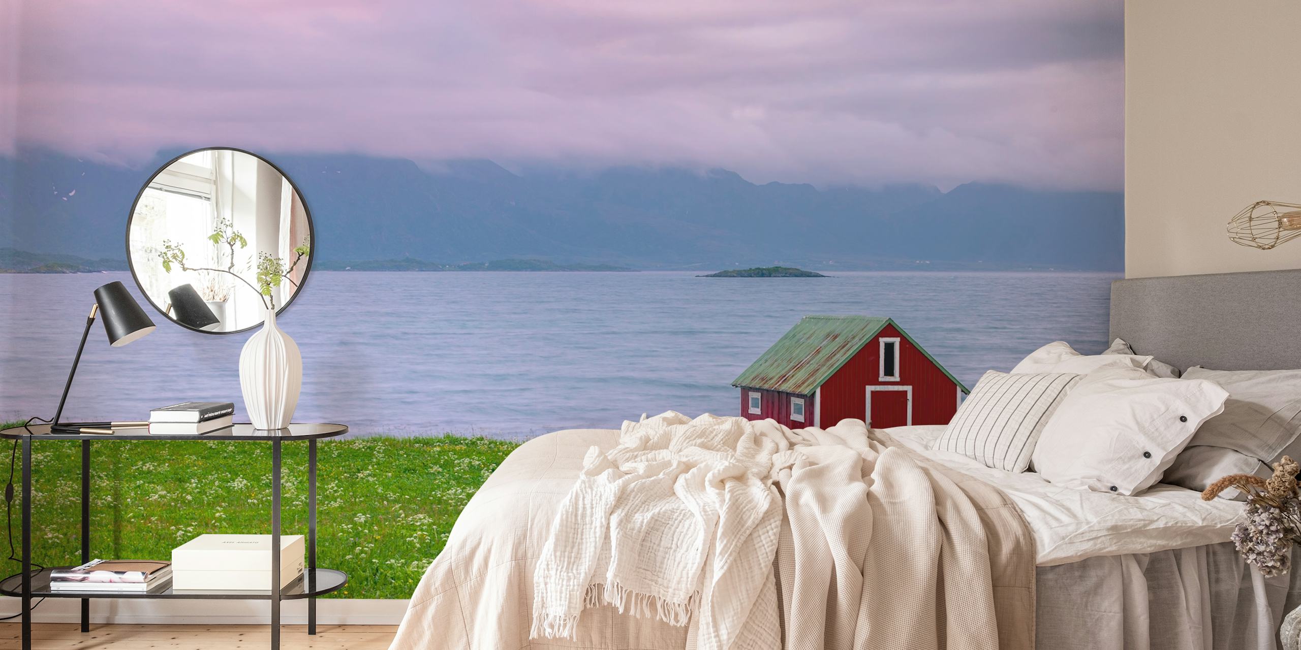 Red cabin by the serene sea with green grass and hills wallpaper