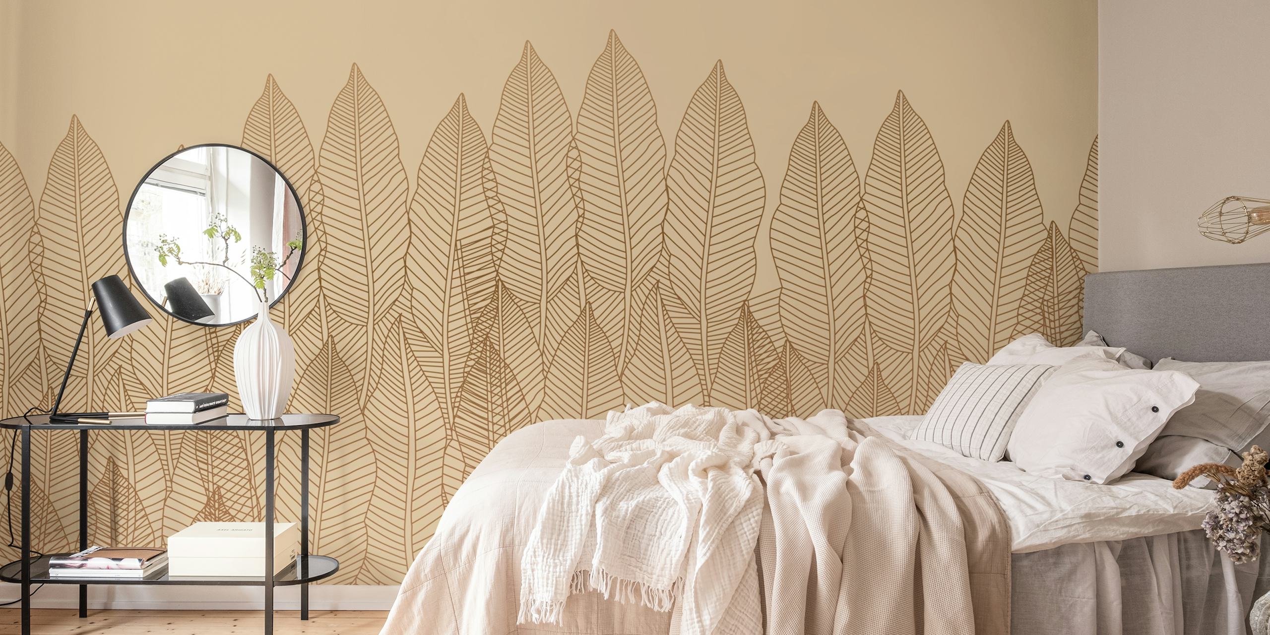Tropical leaf pattern in gold on beige background wallpaper