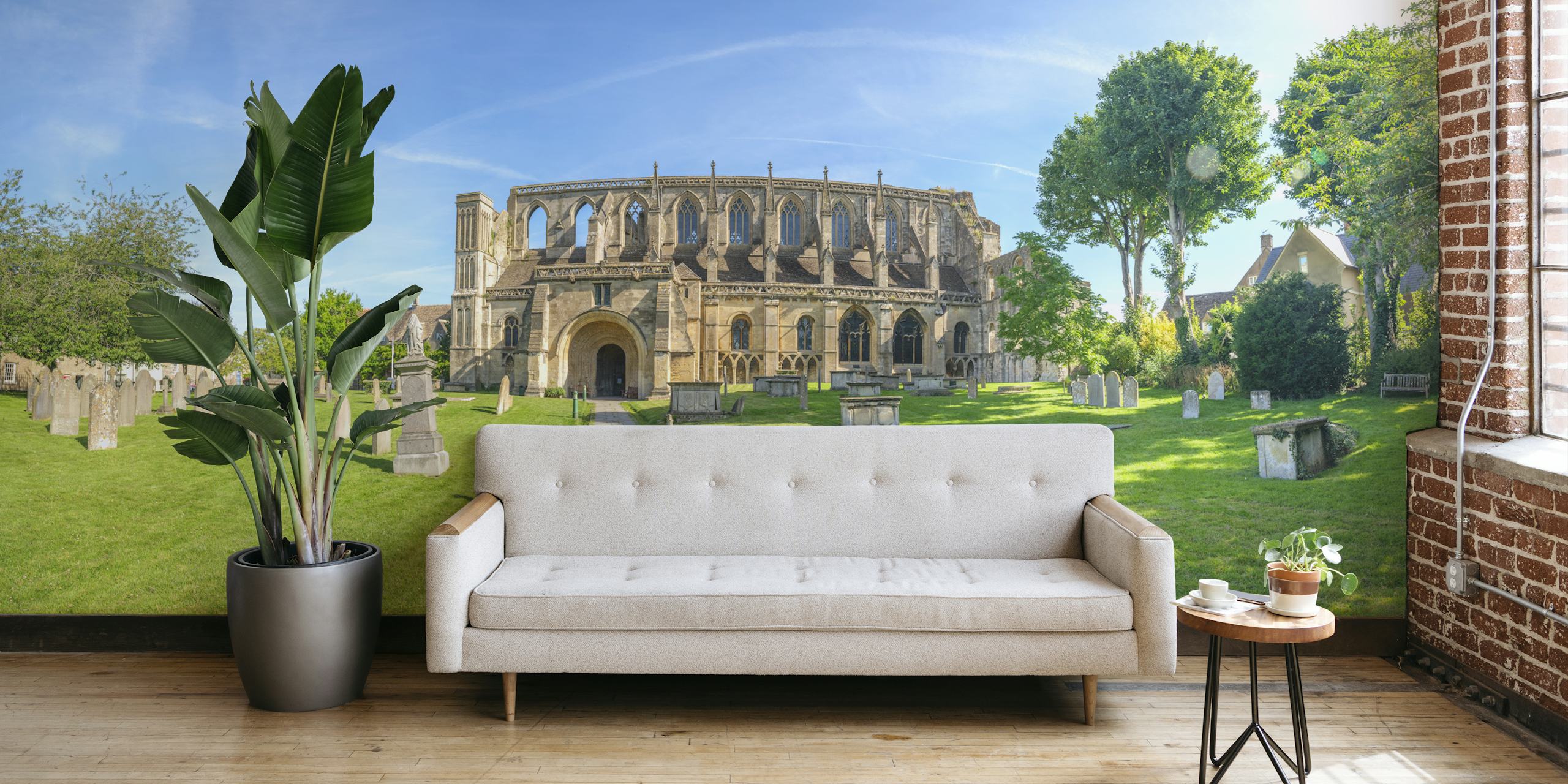 Medieval stone church with green grass and trees wallpaper