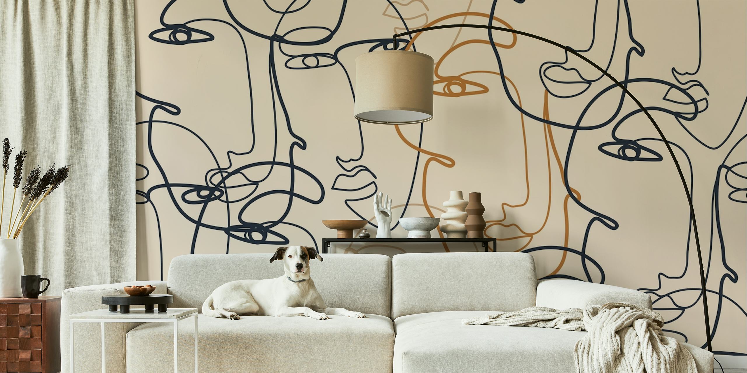 Continuous line art of faces in black, orange on beige wallpaper
