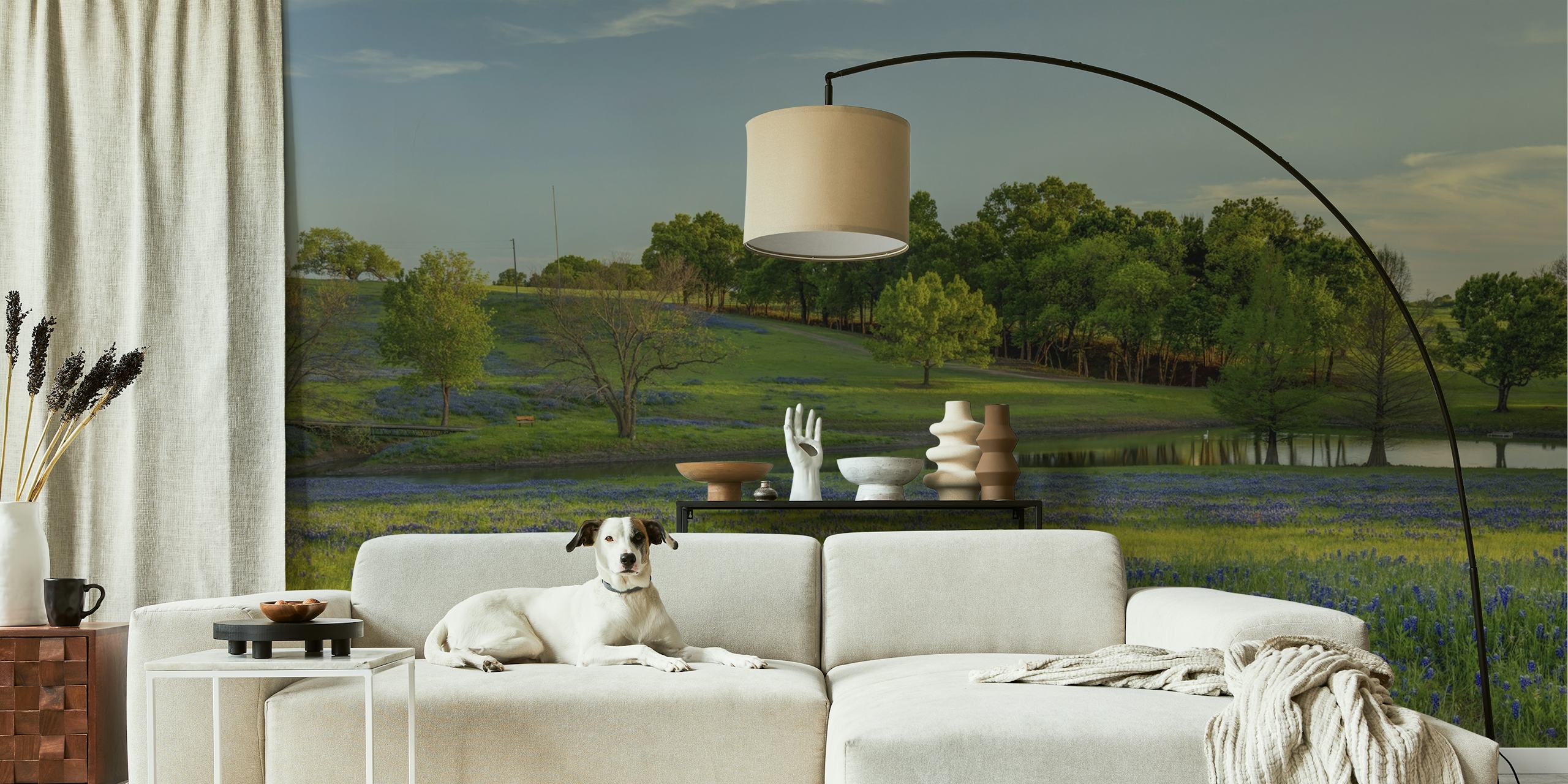 Blue floral patterns over green grass wallpaper