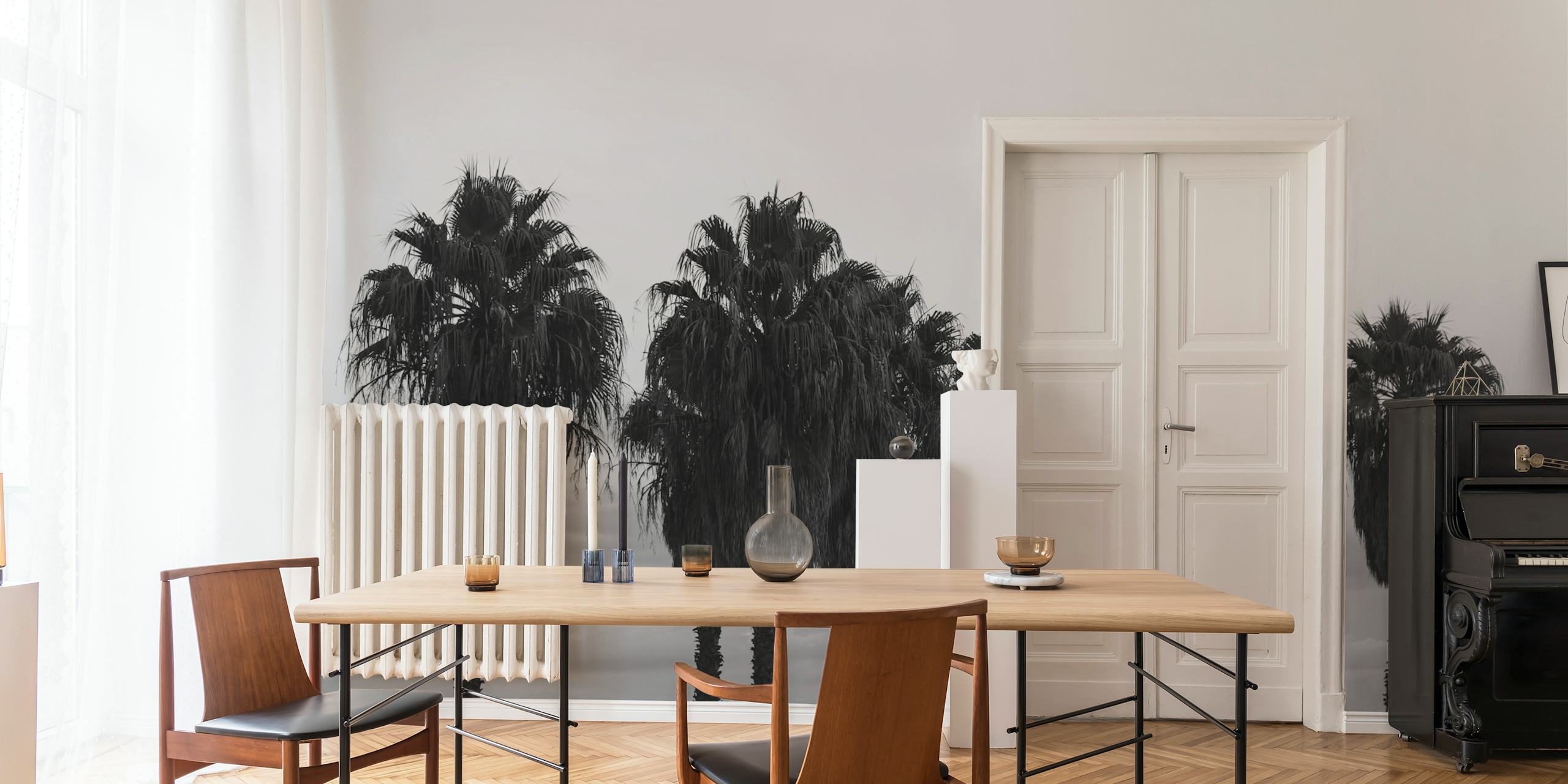 Black and white wall mural featuring a row of palm trees against a misty background, evoking a calm evening ambience