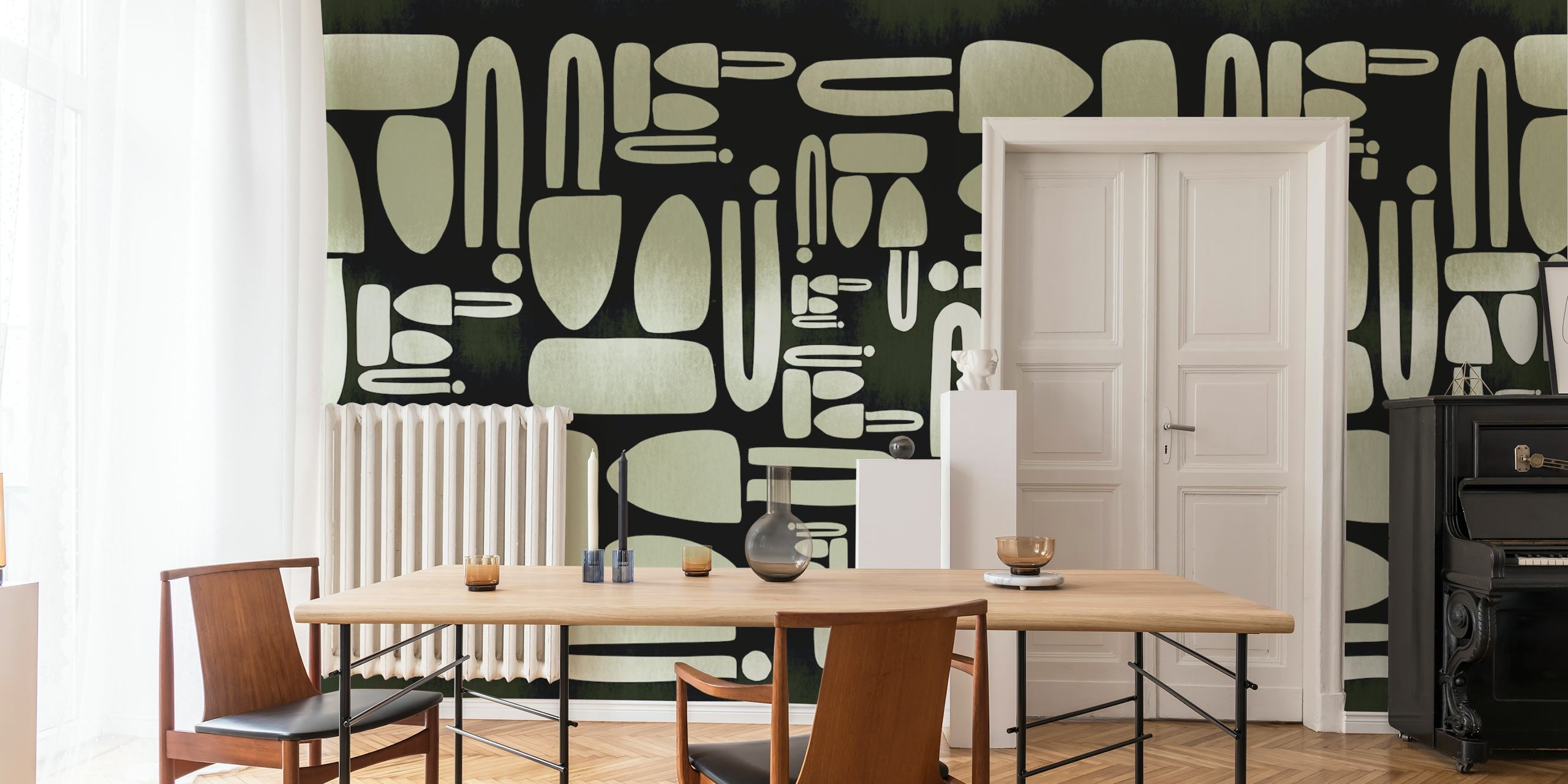 Geometric shapes in soft green and black on wallpaper