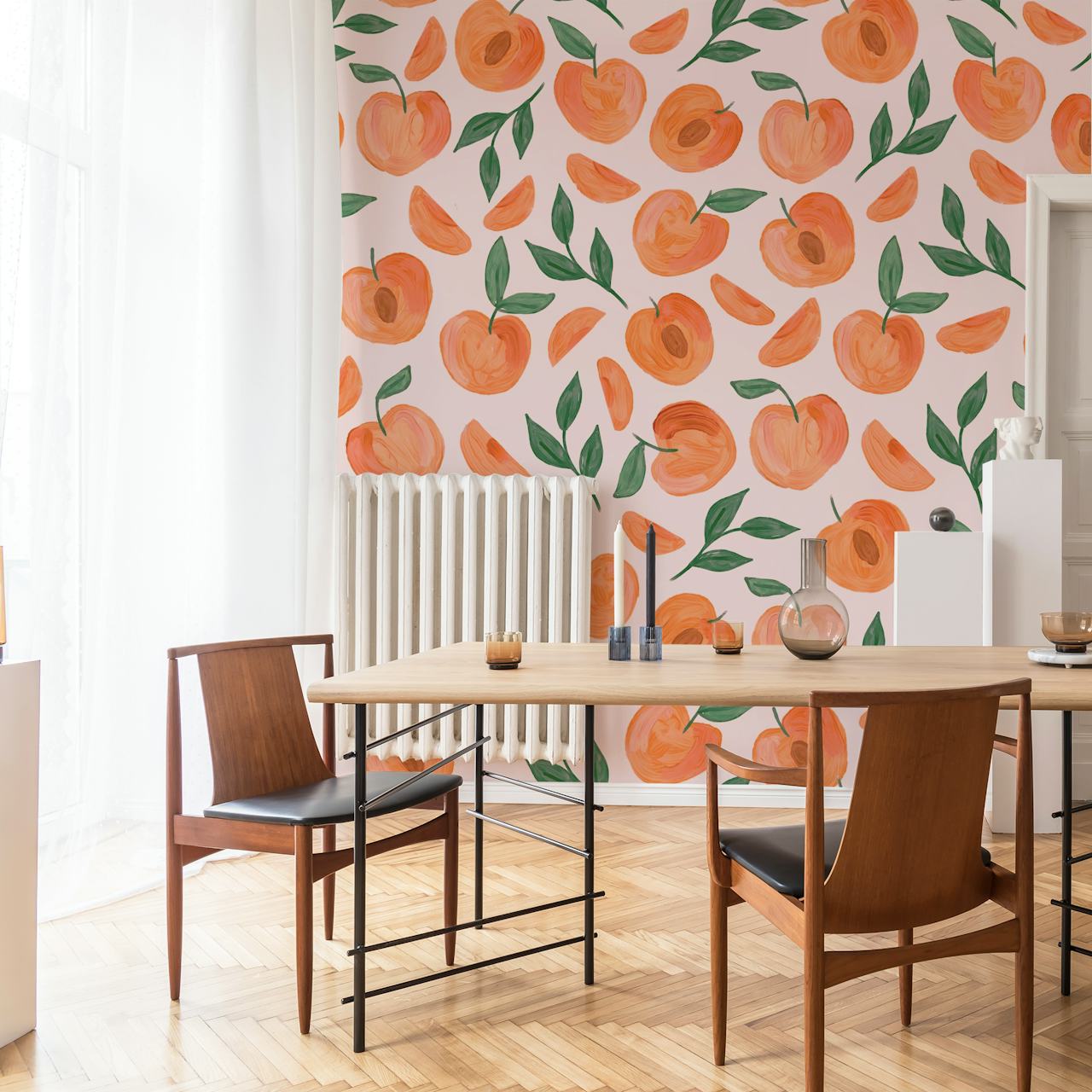Peach and green leaf pattern on light pink wallpaper
