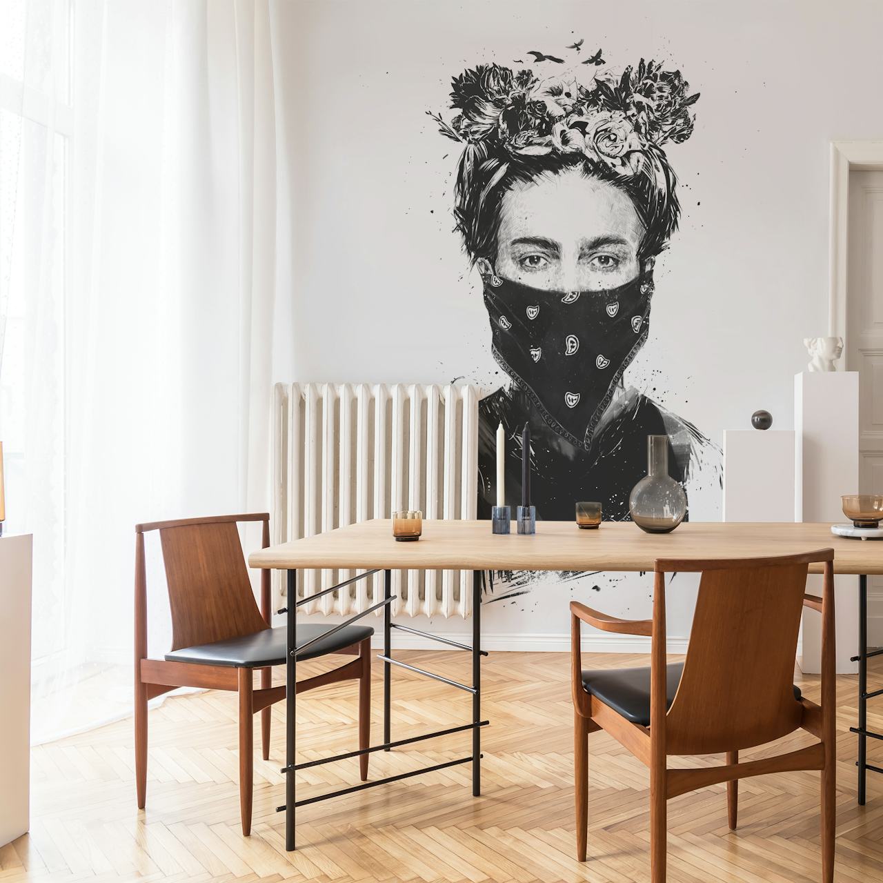 Black and white wall mural of a girl with a flower crown and a patterned scarf over her face
