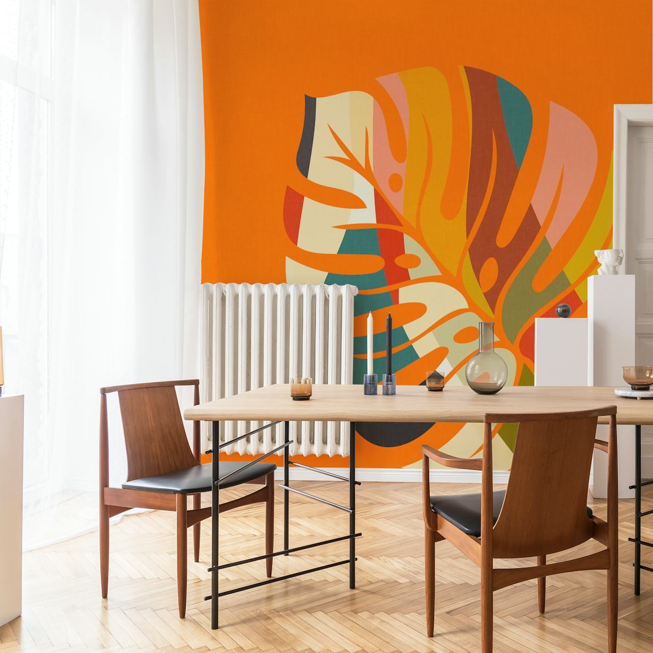 Colorful monstera leaf pattern on orange background wallpaper