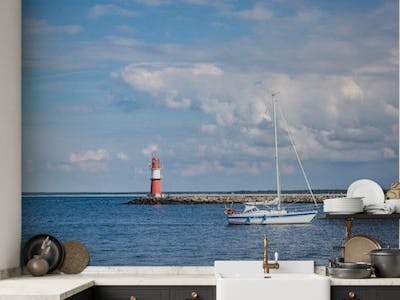 Baltic Sea In North East Germany With Lighthouse And Boat