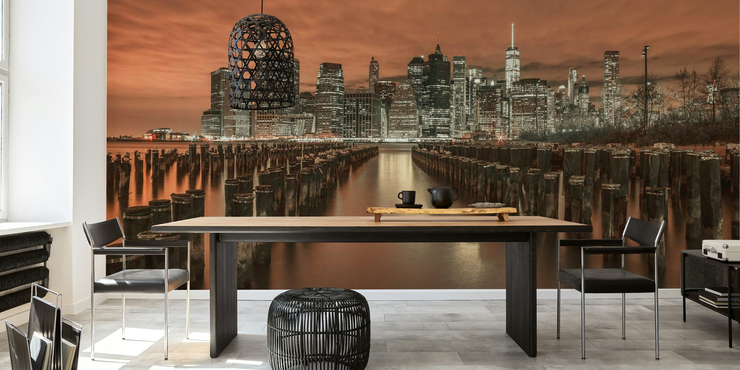 Manhattan skyline wall mural with groynes leading into the water in sepia tones