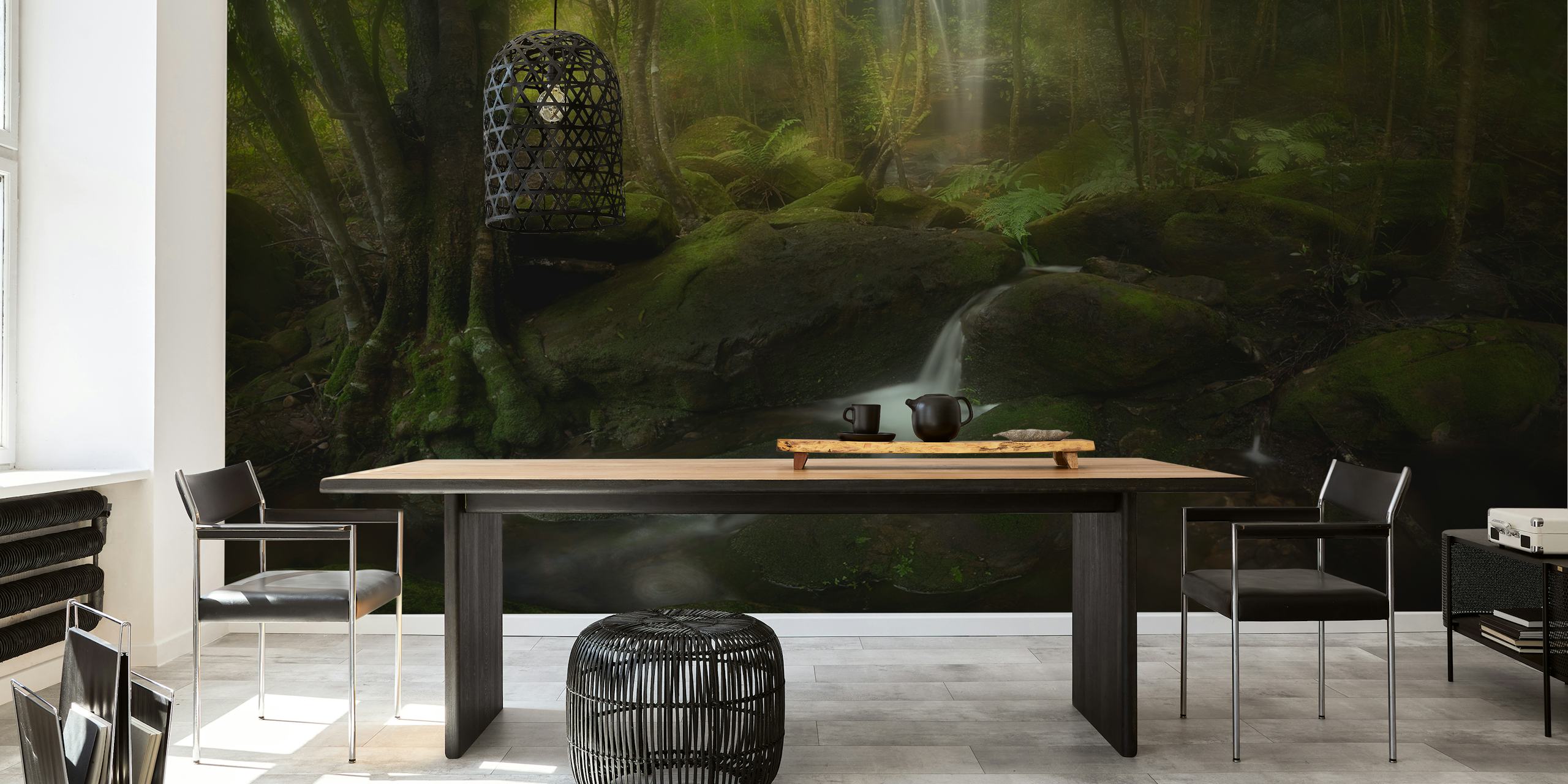 Lush green forest with a waterfall and rocks wallpaper