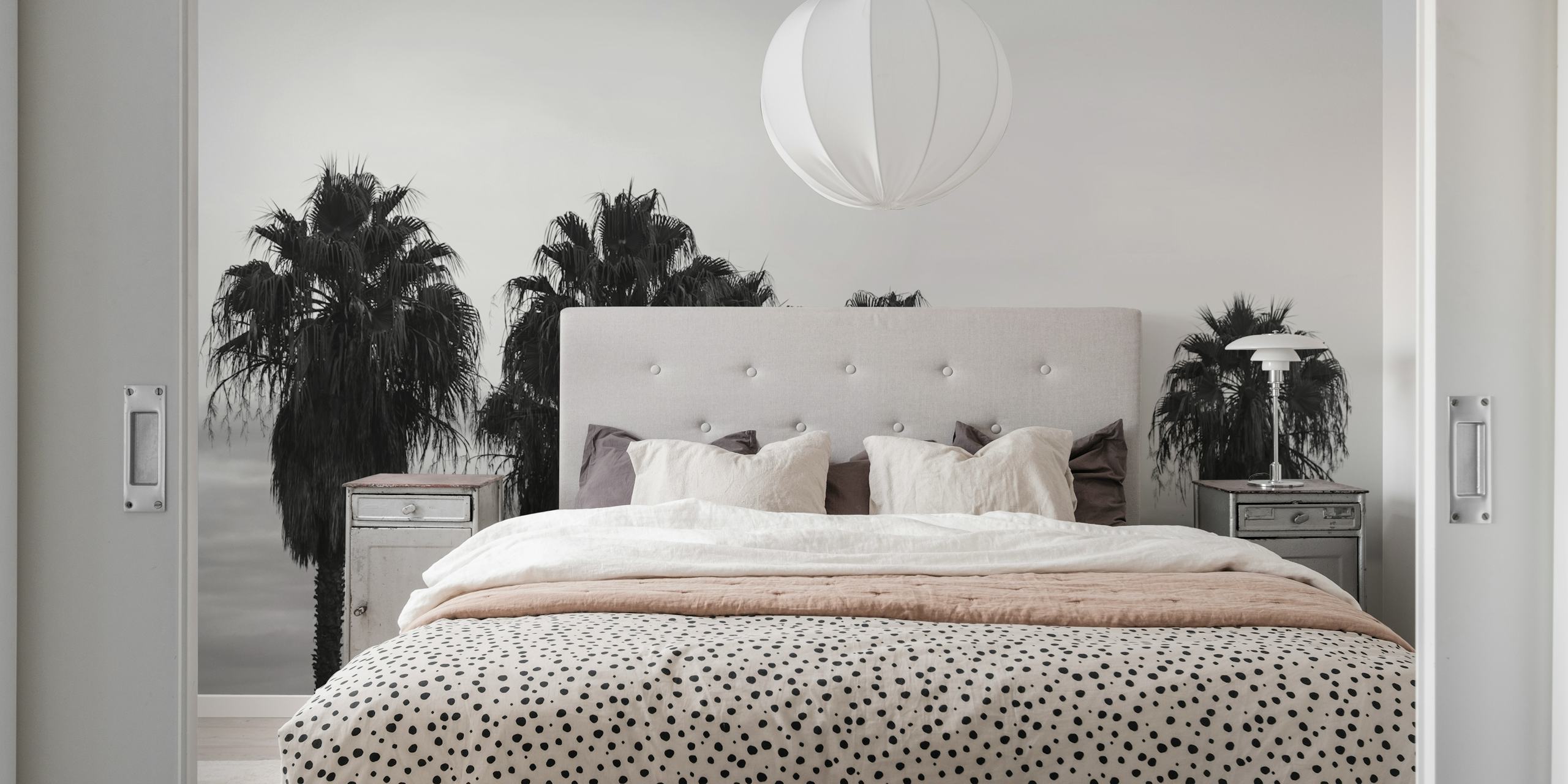 Black and white wall mural featuring a row of palm trees against a misty background, evoking a calm evening ambience