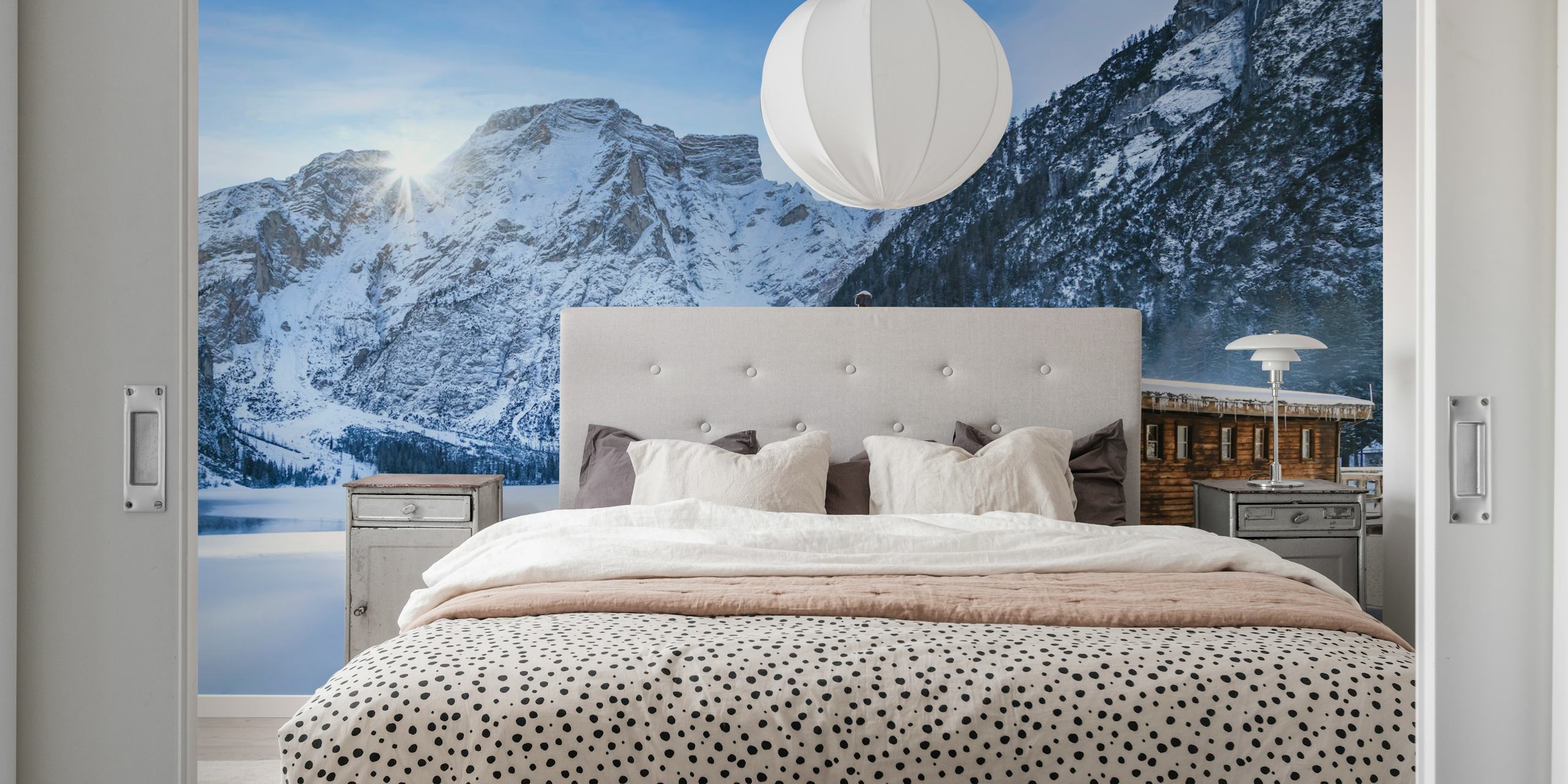 Lake Braies winter landscape wallpaper in blue and white tones featuring a cabin and mountains.