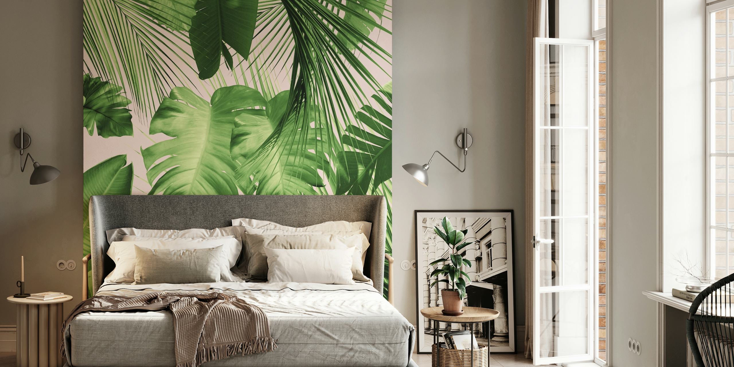 Tropical green leaf patterns on a pink backdrop wallpaper