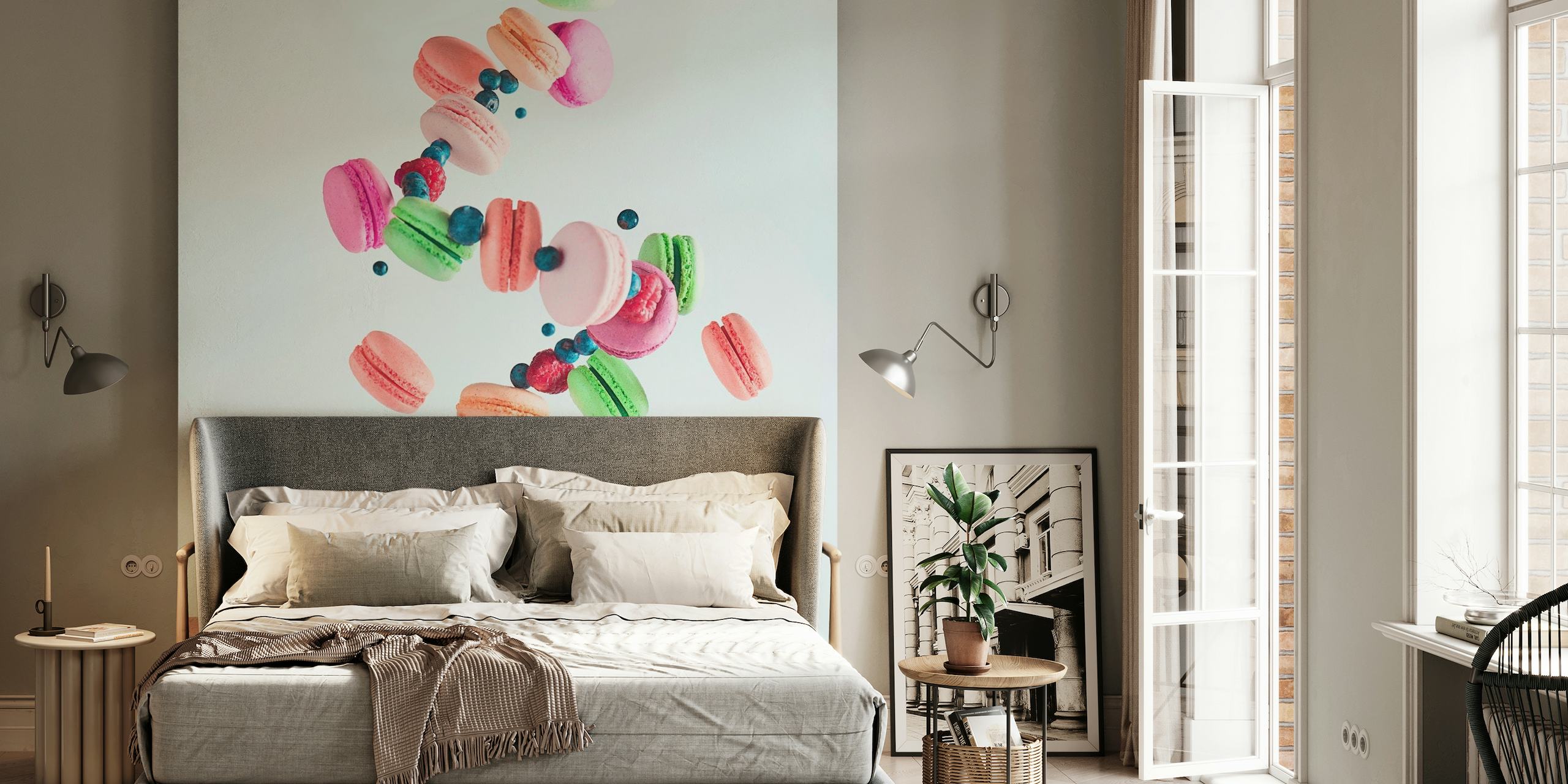 Zwevende kleurrijke macarons muurschildering met een hand