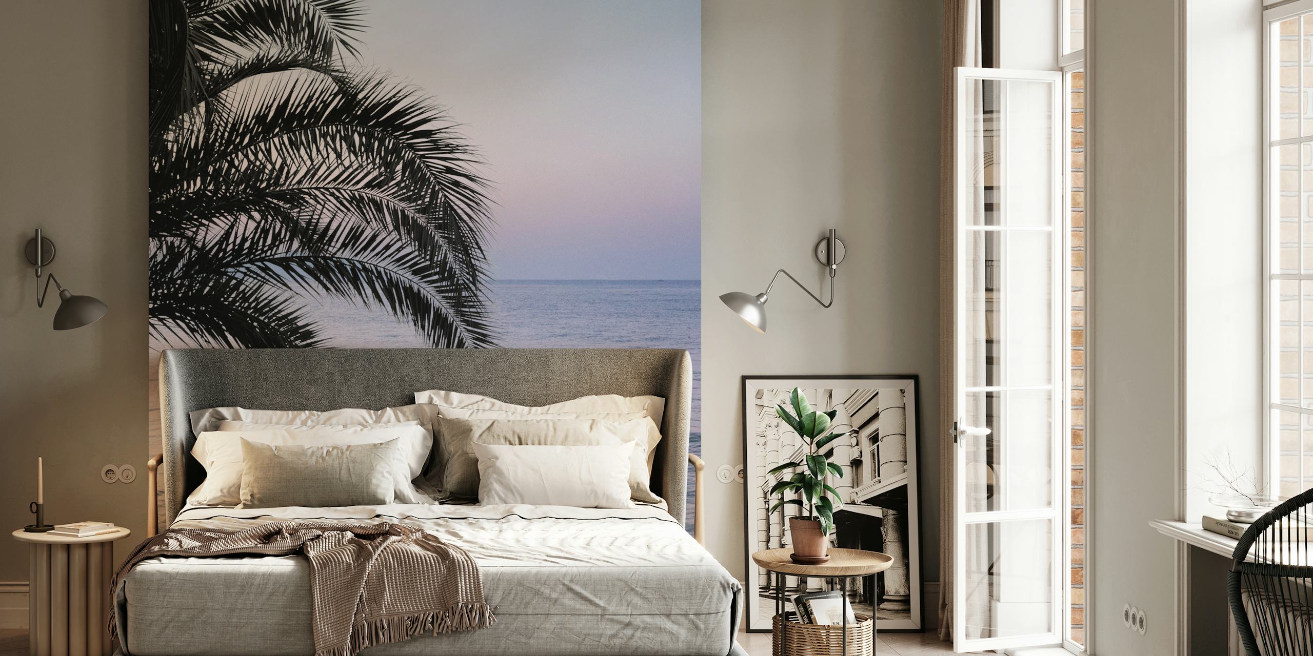 Tropical palm leaves over a soft ocean sunset wallpaper