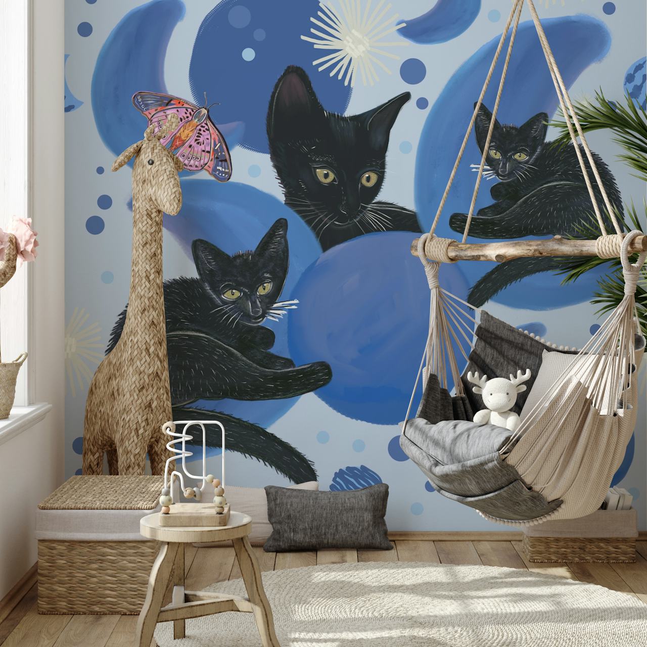 Svarta katter varvat med månfaser och stjärnor på en väggmålning