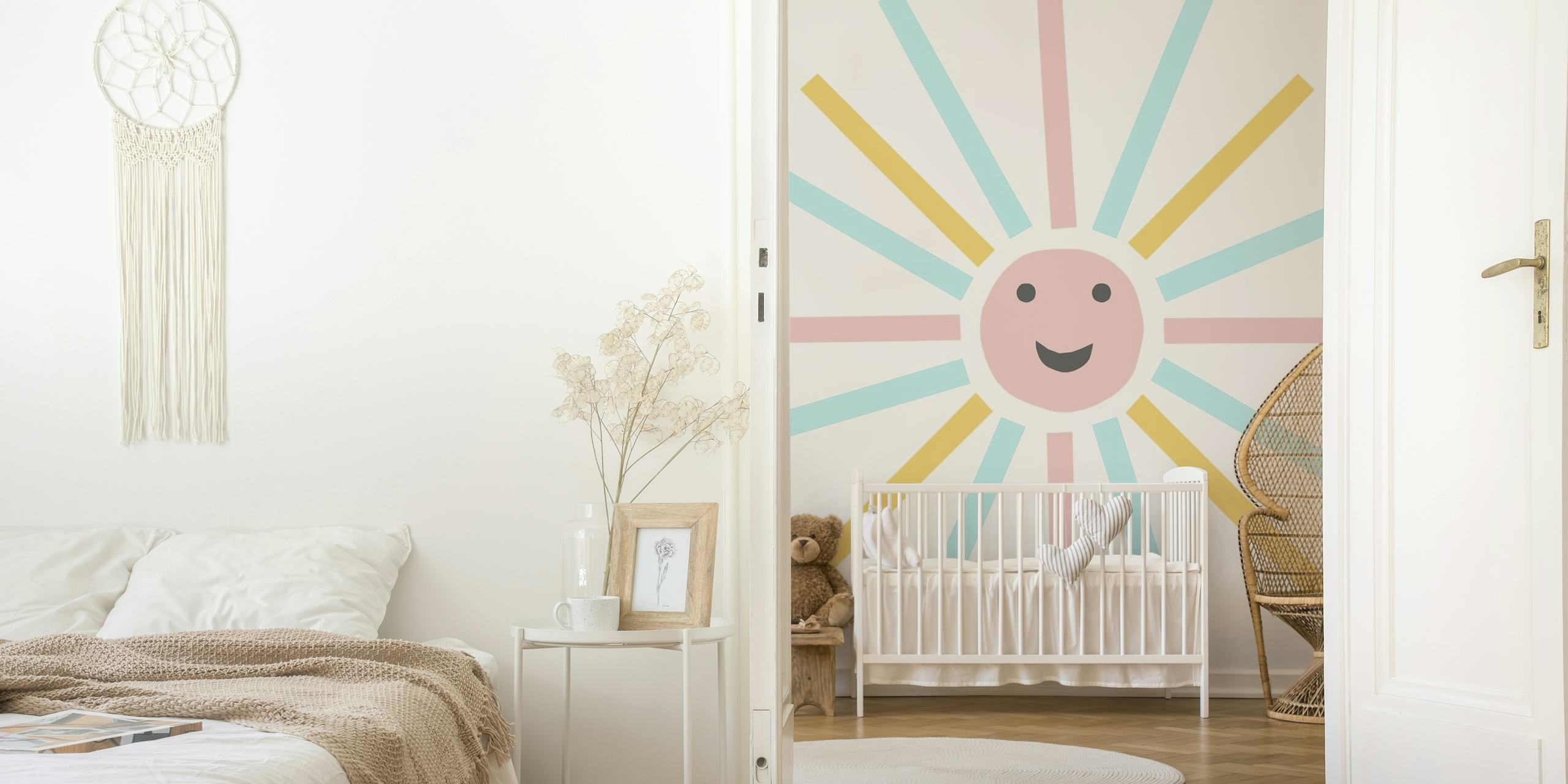 Cheerful retro-style sunburst wall mural with pastel pink, blue, and yellow rays and a smiling sun face in the center