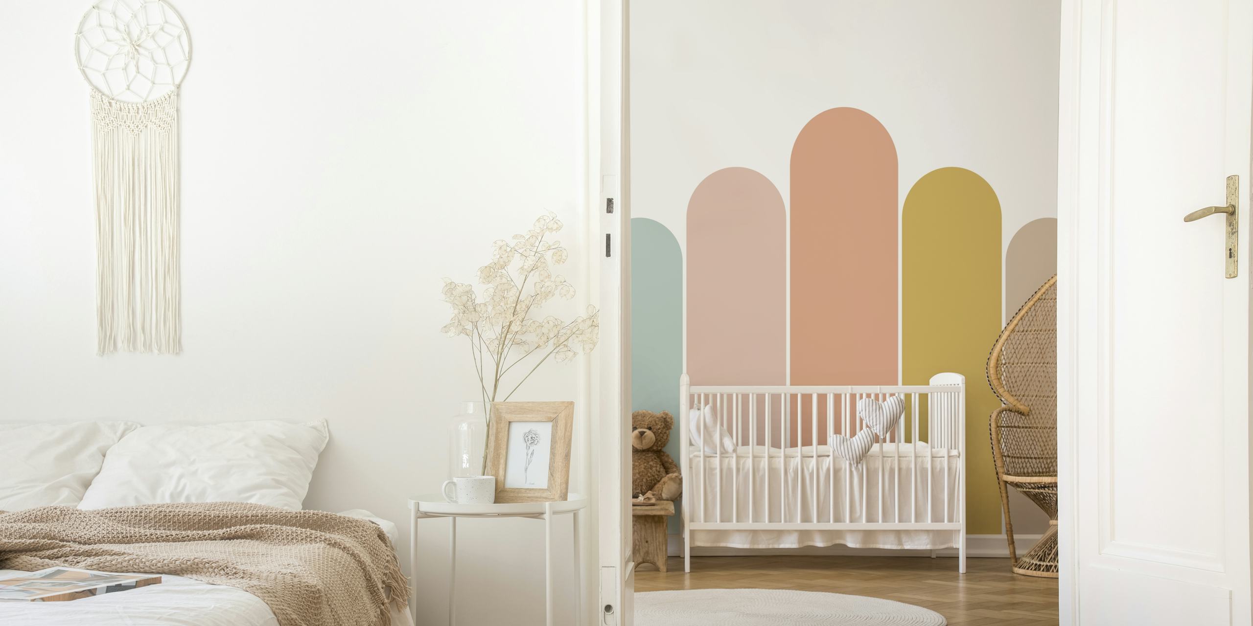 Pastel colored arches wallpaper in blue, pink, yellow, and beige tones.