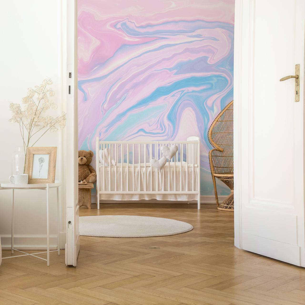 Swirling pastel colors in pink, blue, and lavender marble wallpaper